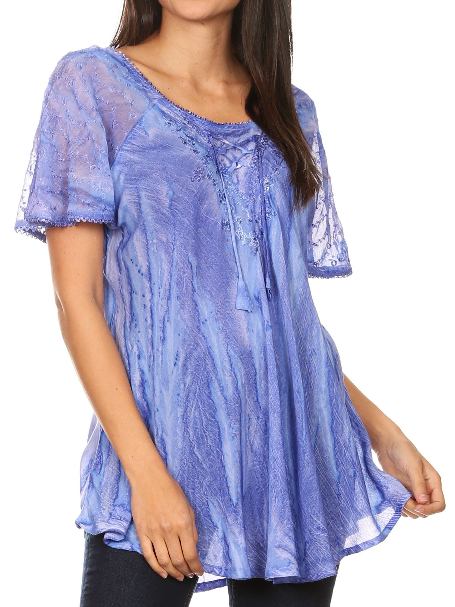 Woman wearing a blue lace top on a white background