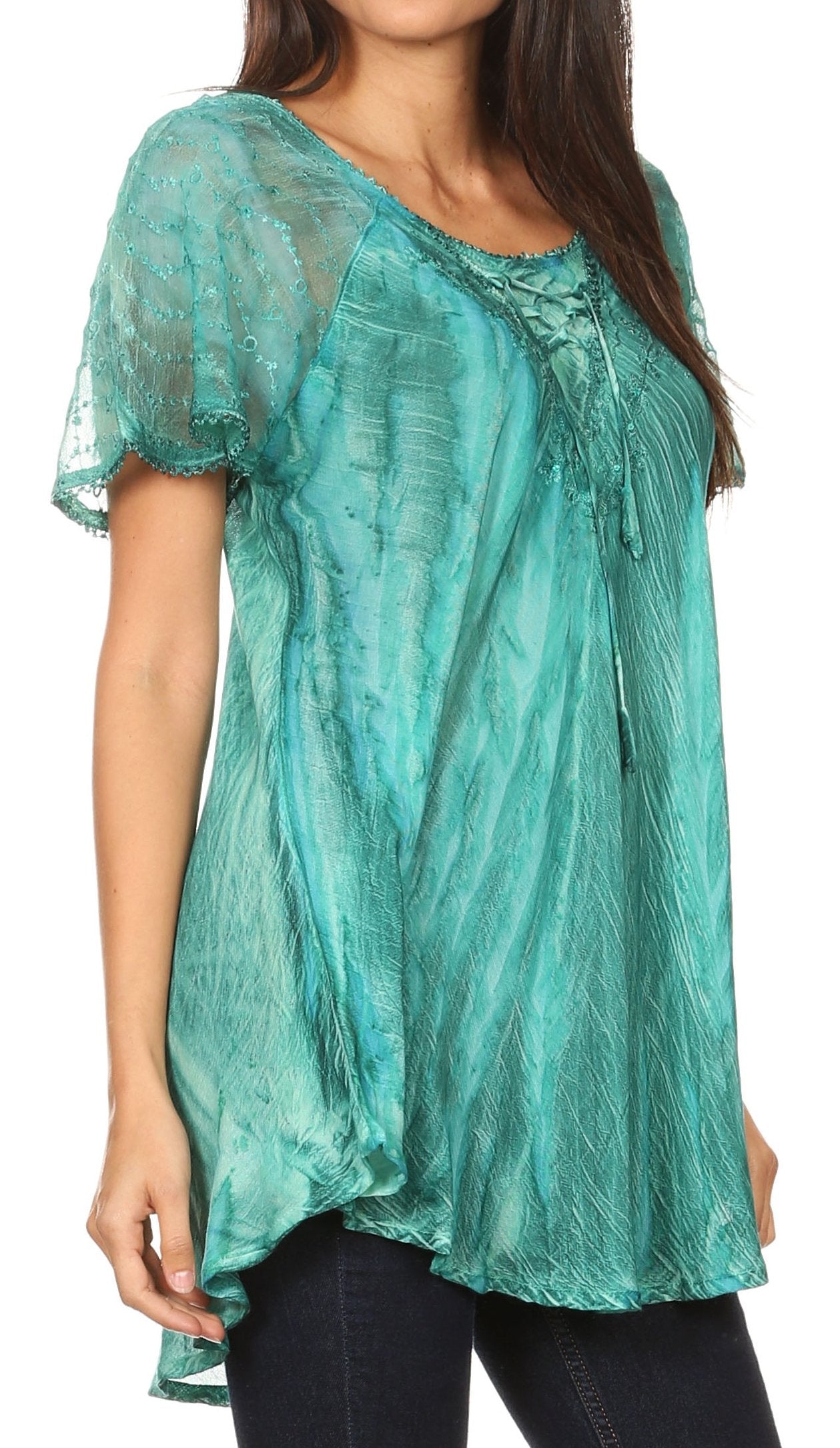 Teal lace top worn by a model on a white background