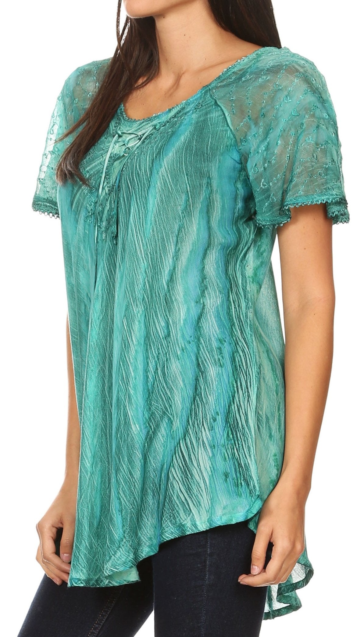 Woman wearing a teal lace top with short sleeves on a white background