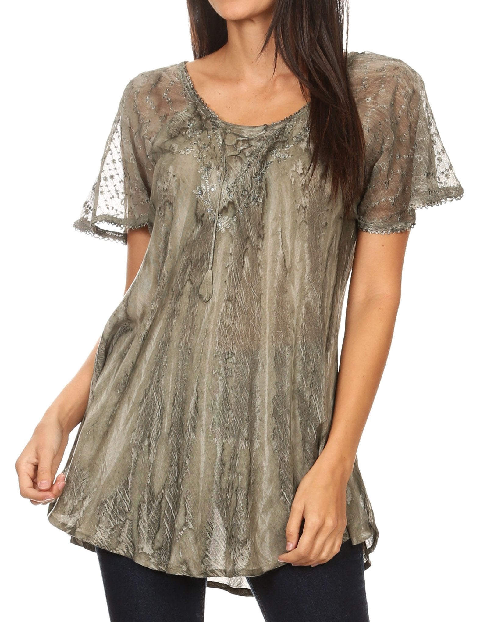 Woman wearing a sheer lace overlay top on a white background