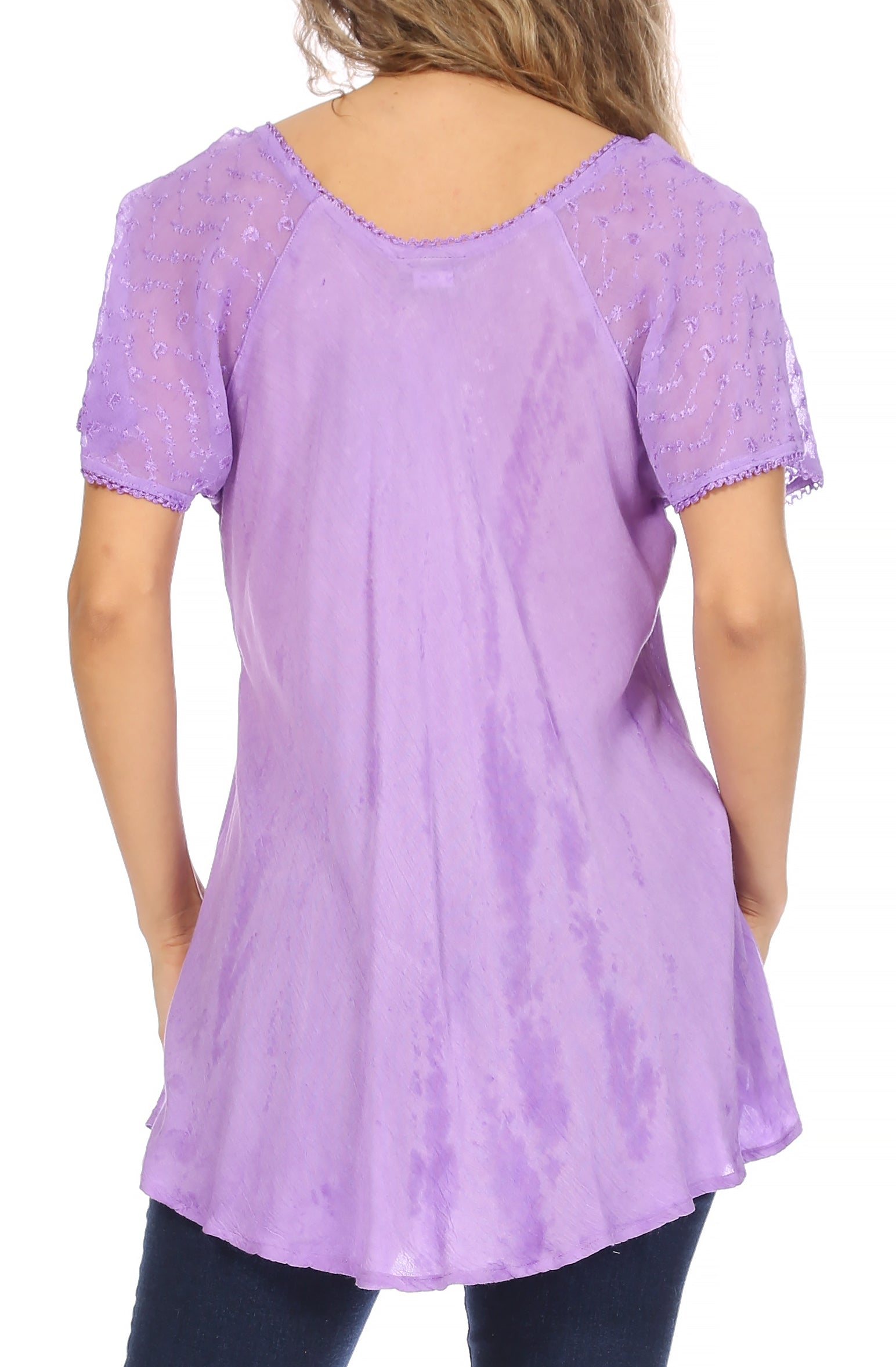 Lavender lace-trimmed top worn by a person on a white background