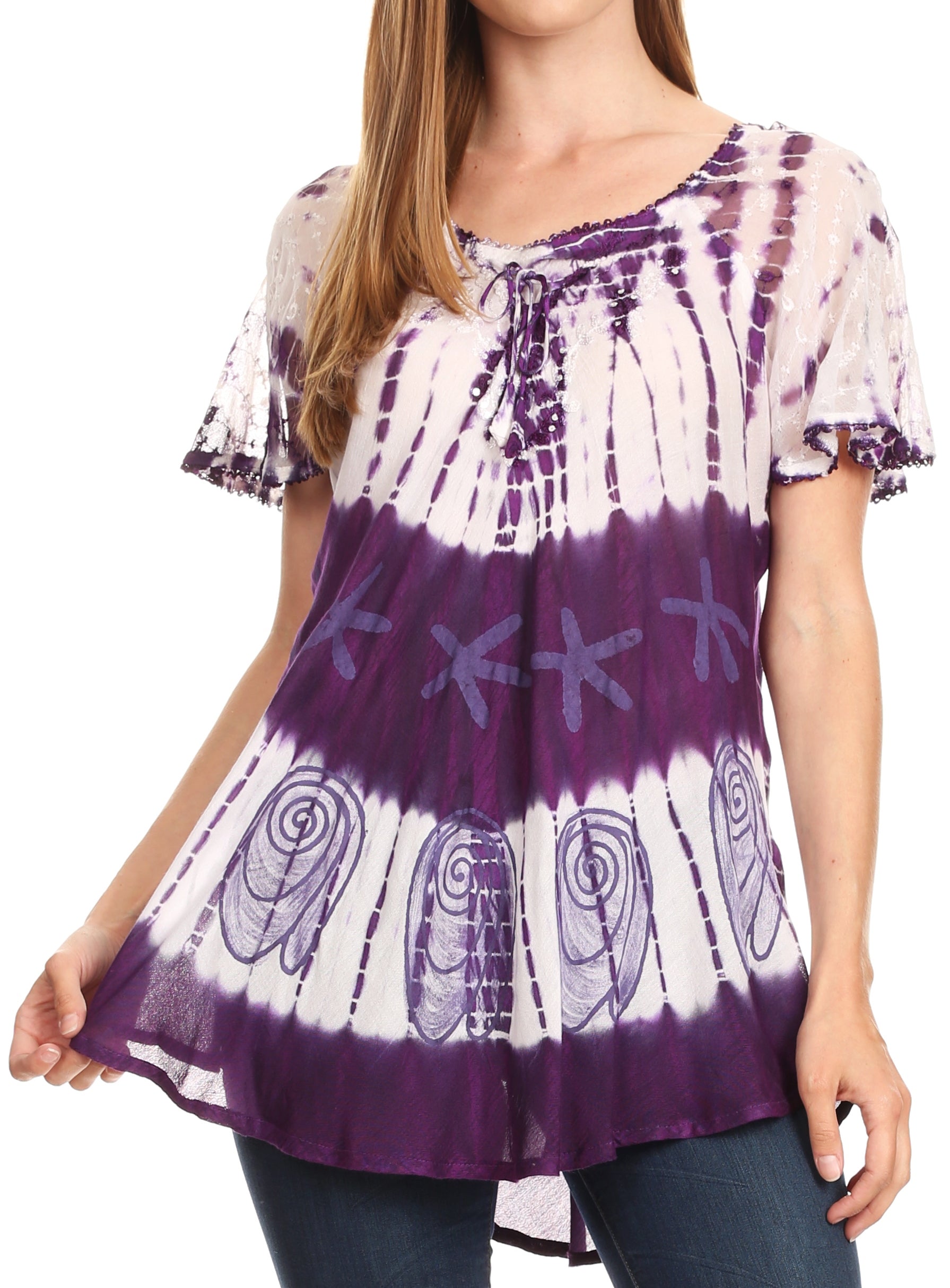 Woman wearing a purple and white tie-dye top with a plain background