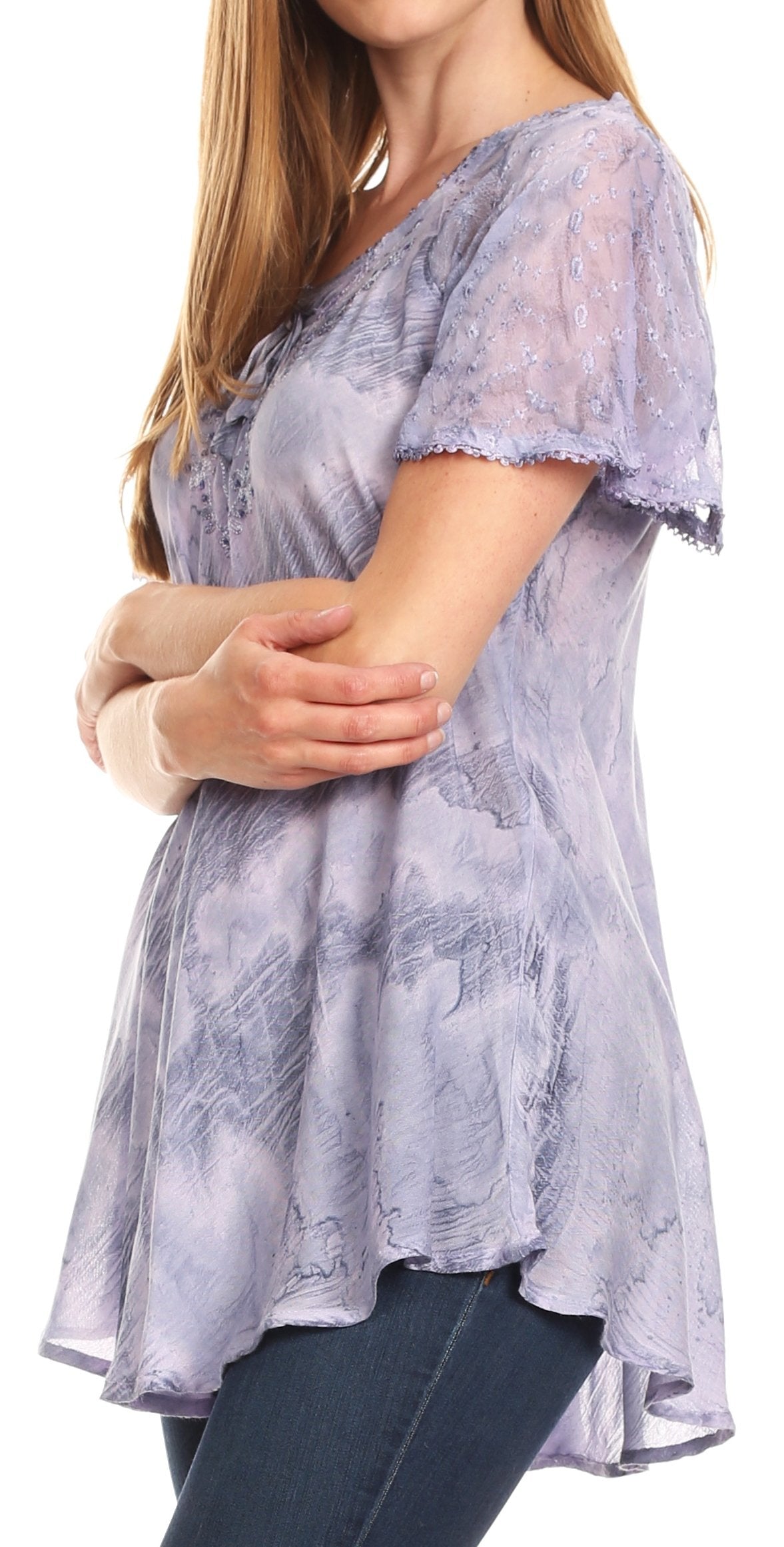 Woman wearing a light purple lace top with short sleeves on a white background