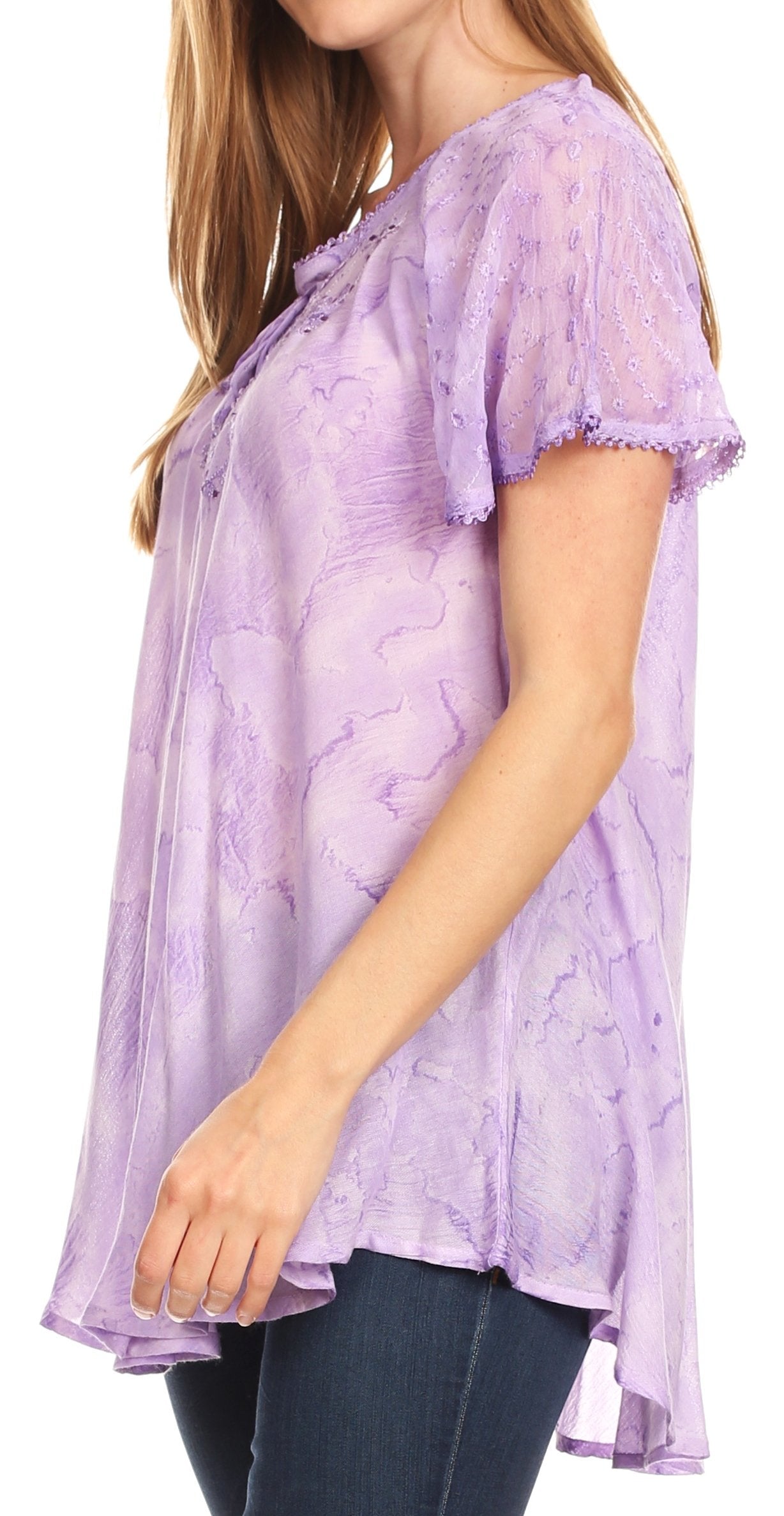Woman wearing a purple lace top with a white background