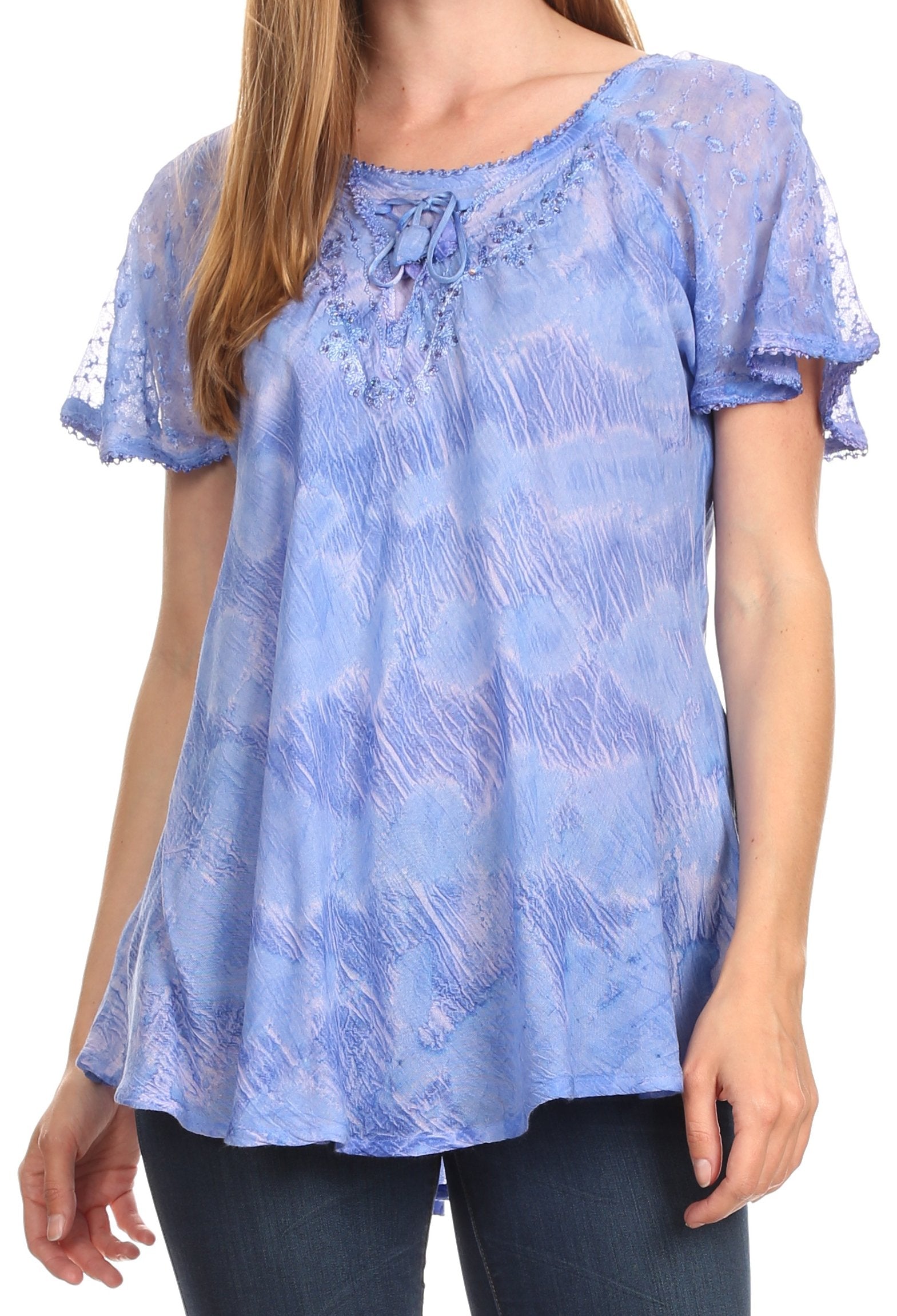 Blue lace top worn by a person on a white background