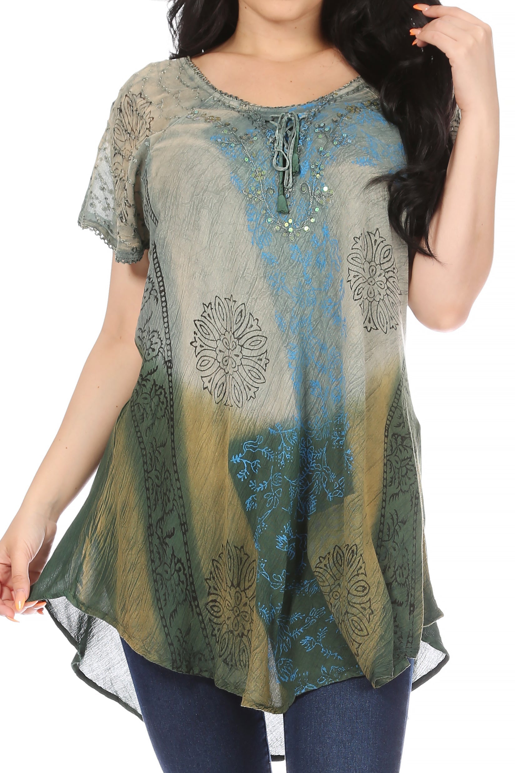 Woman wearing a patterned top with a gradient design on a plain background