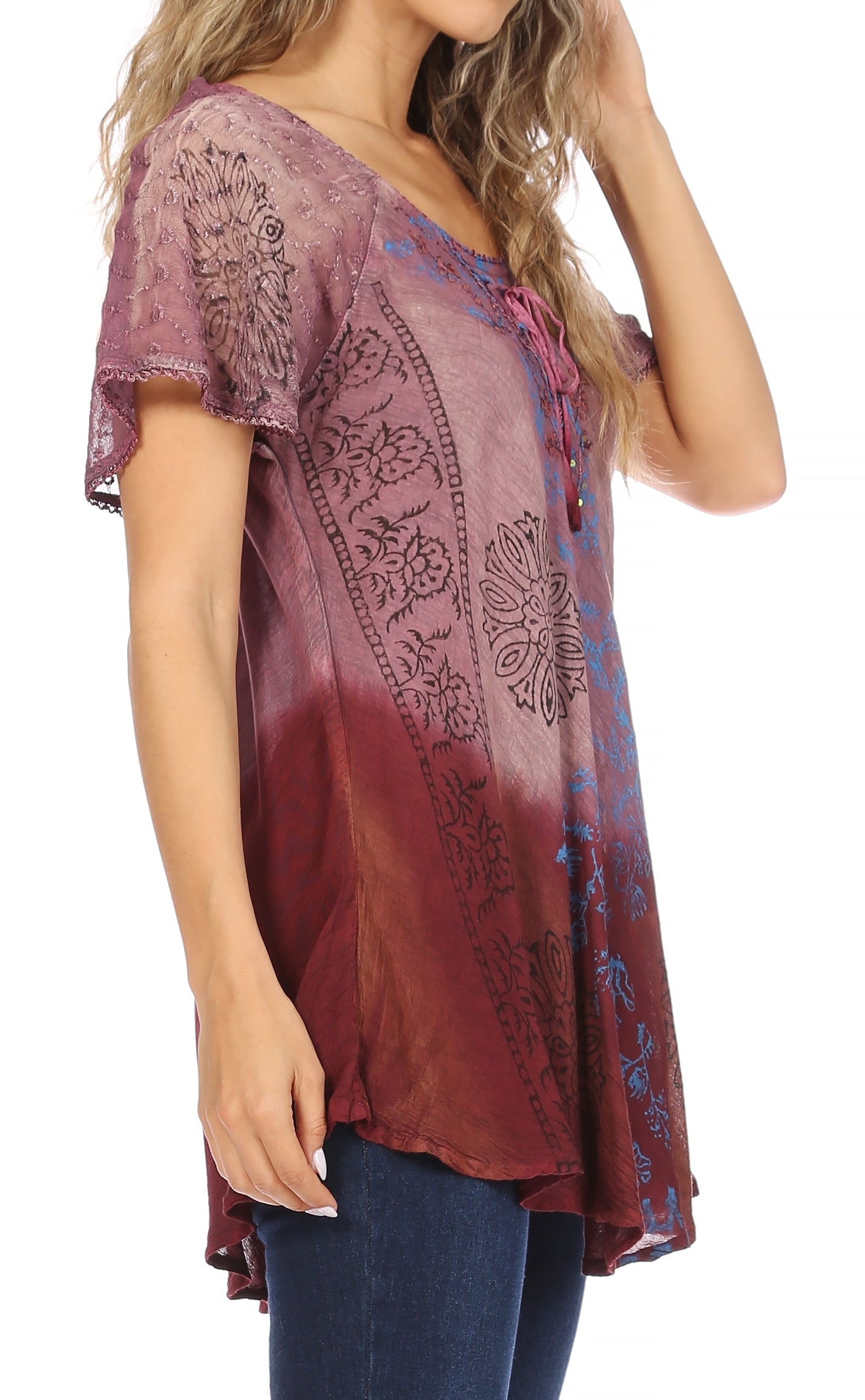 Woman wearing a patterned blouse with a gradient design on a white background