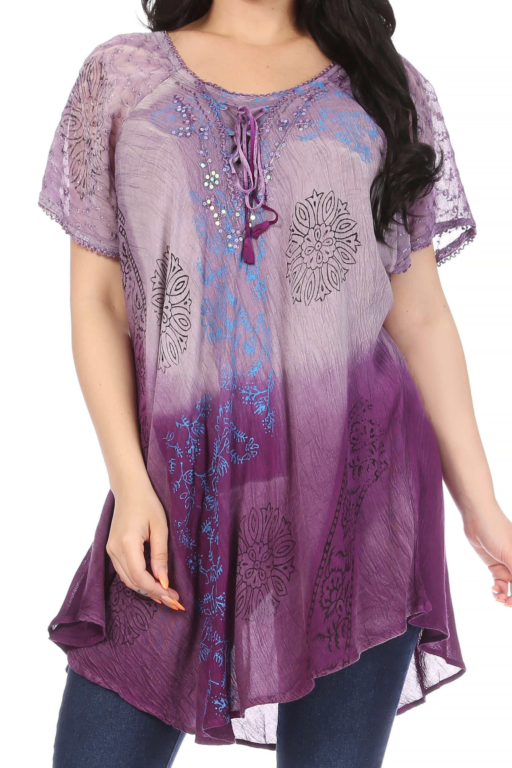 Purple and blue patterned top worn by a model on a white background
