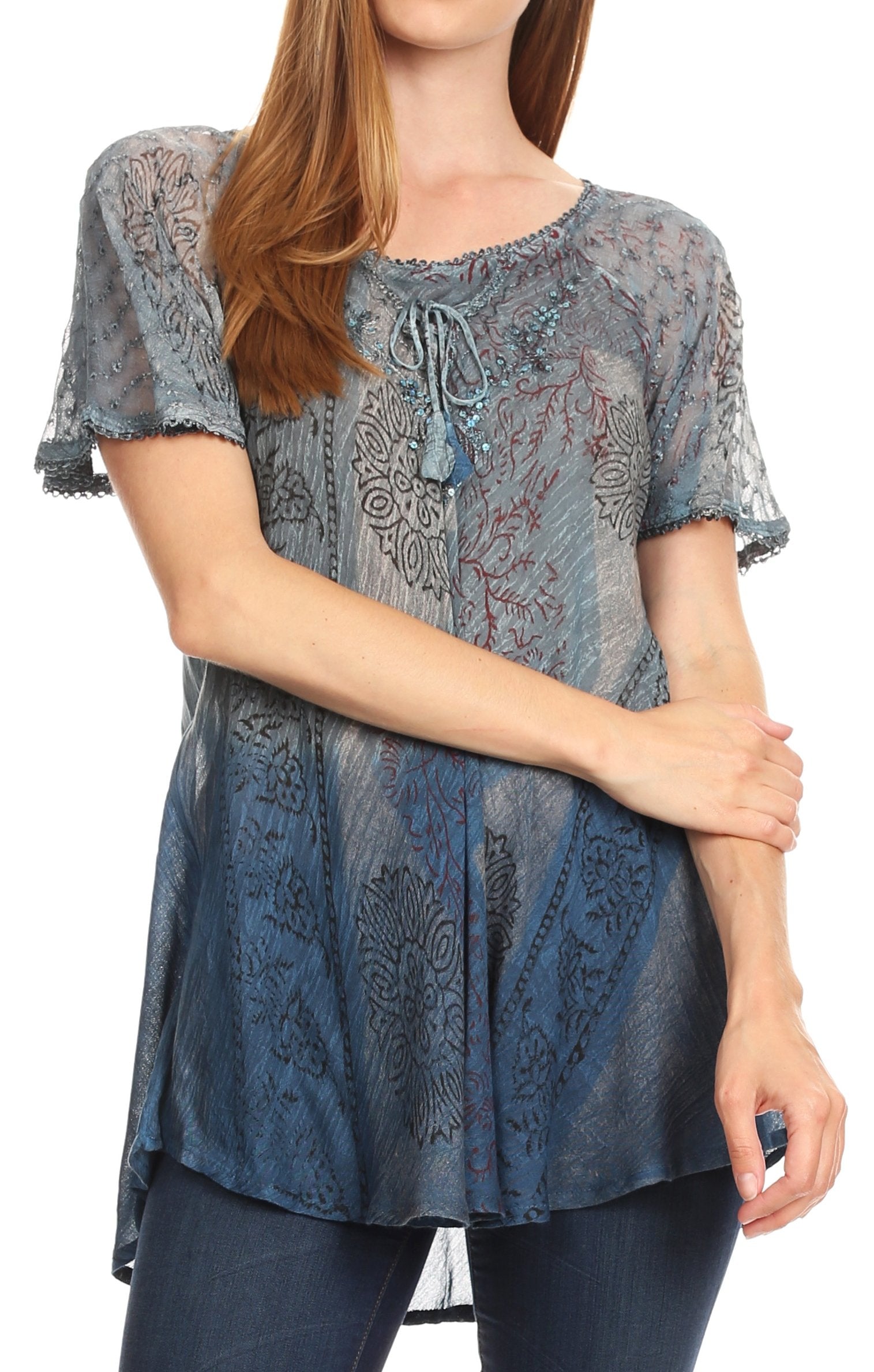 Woman wearing a patterned blue blouse on a white background