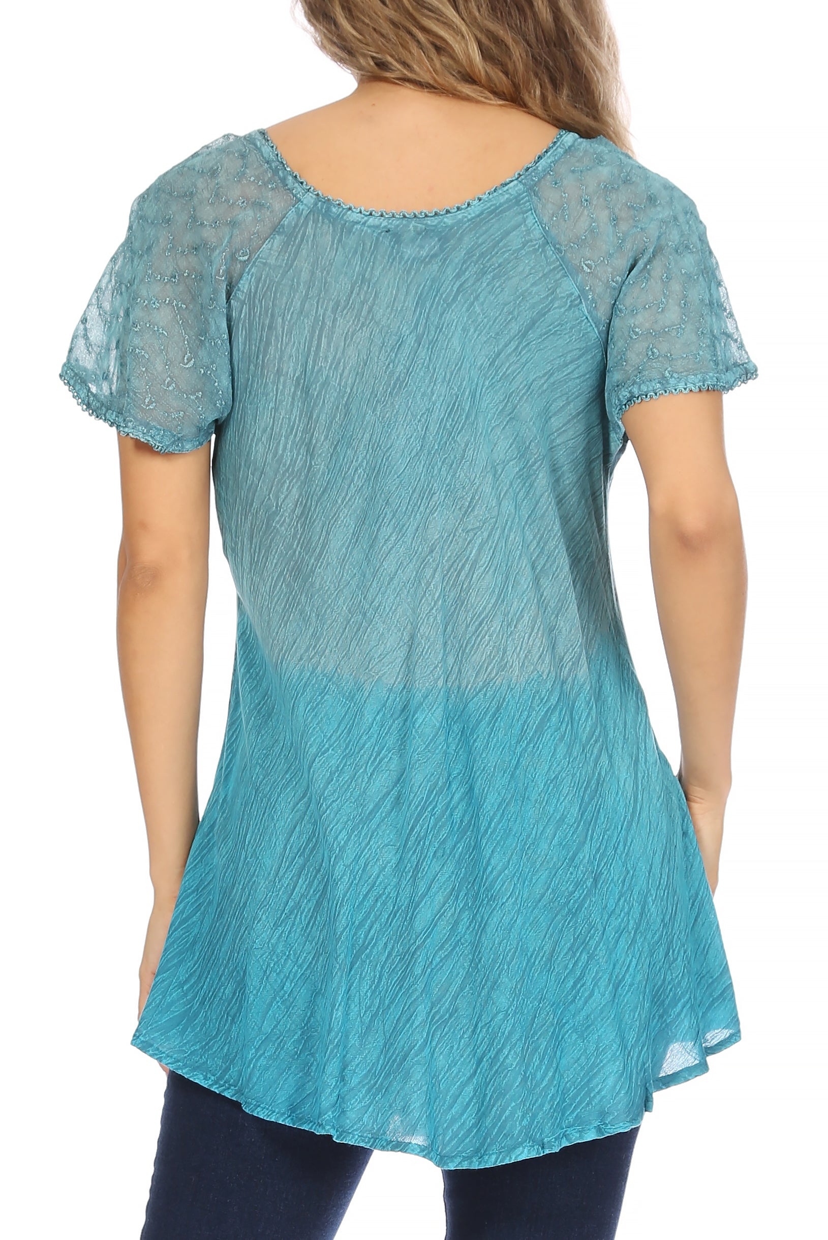 Blue lace top worn by a person on a white background