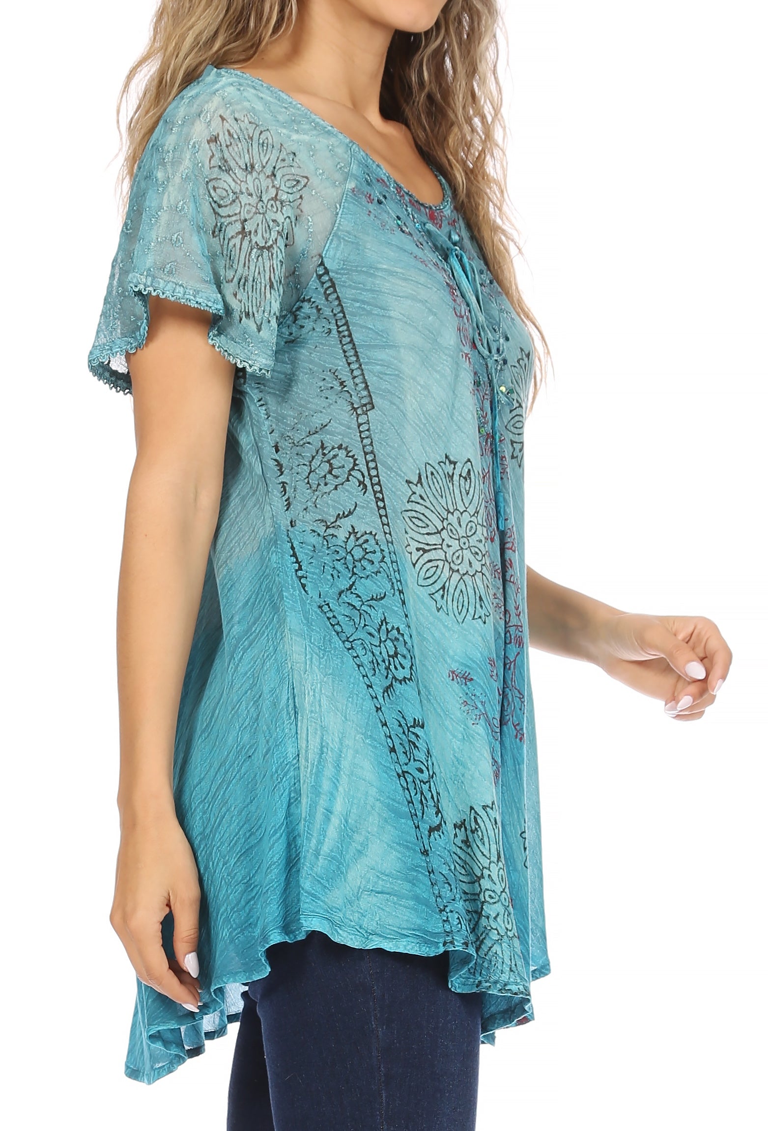 Woman wearing a blue patterned top on a white background