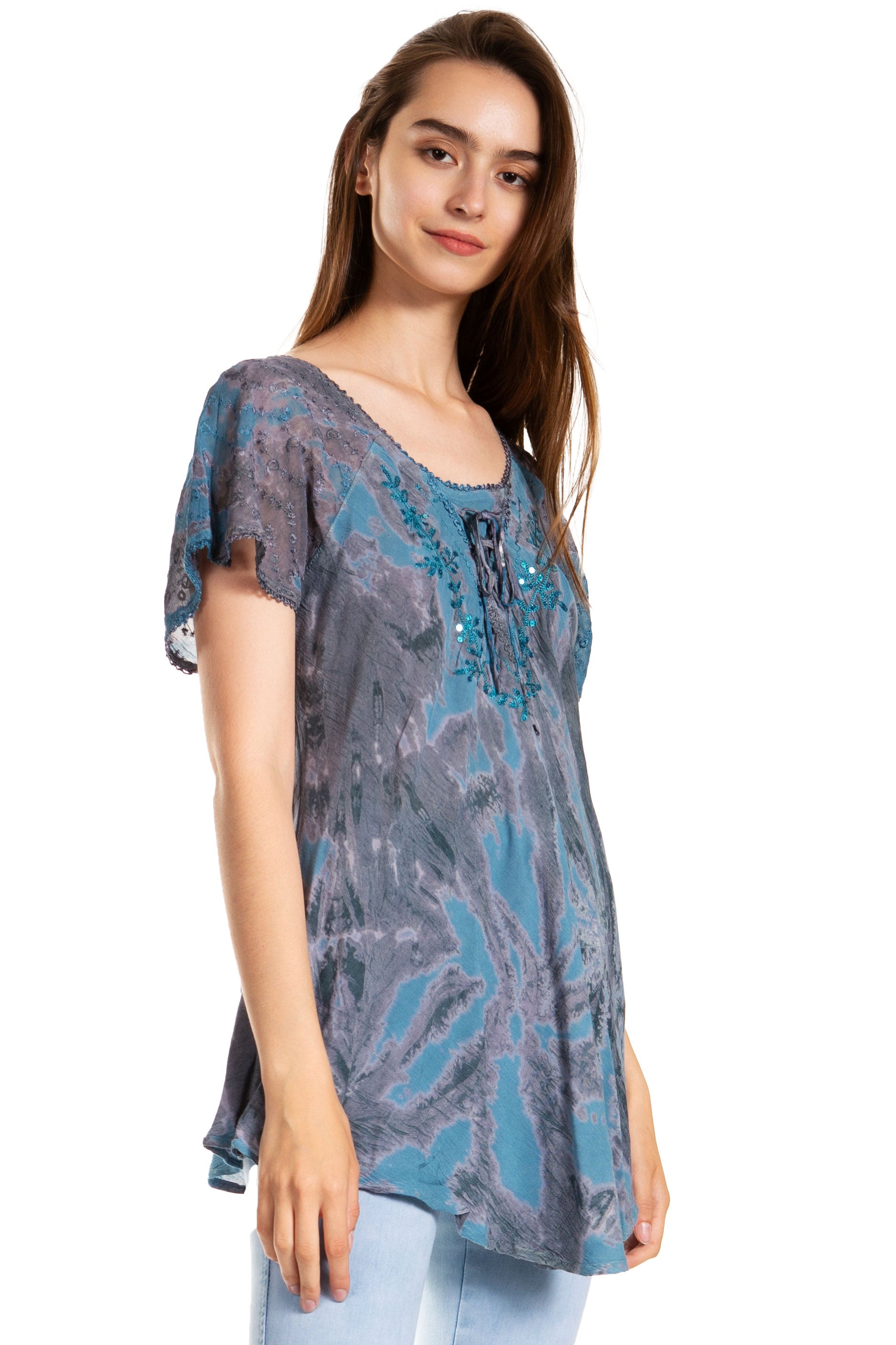 Woman wearing a blue patterned blouse on a white background