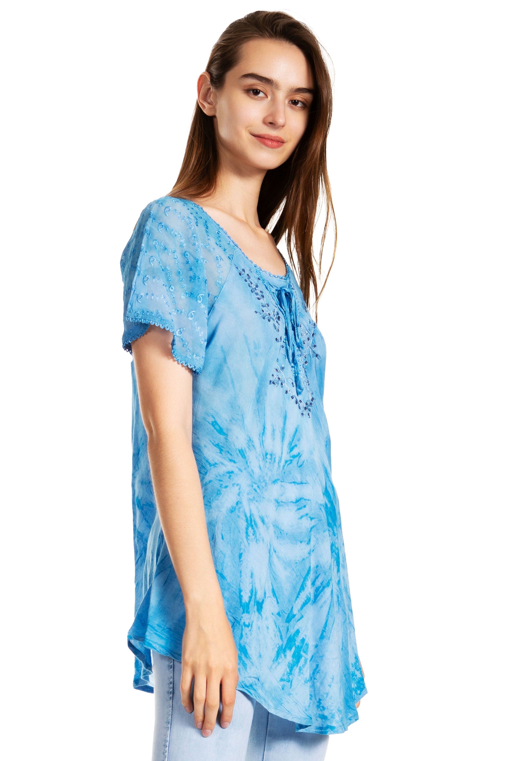 Woman wearing a blue tie-dye blouse on a white background