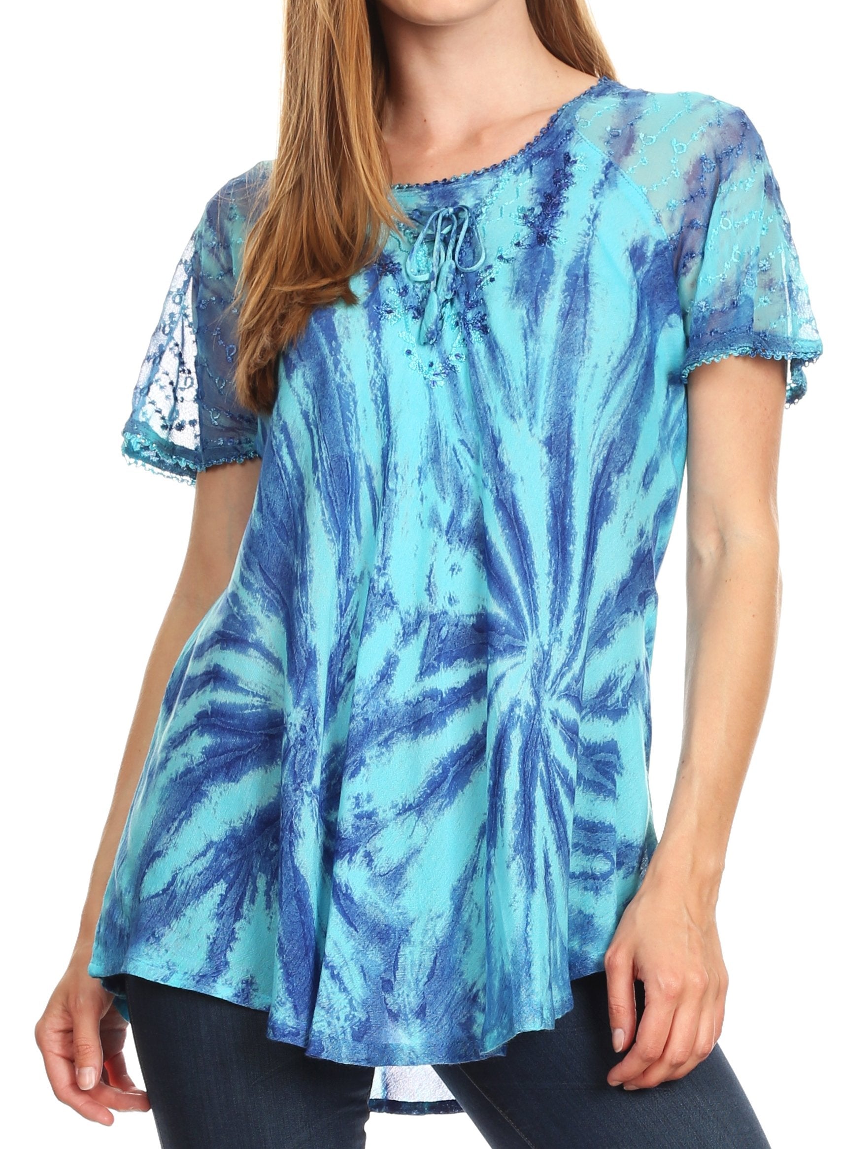 Woman wearing a blue tie-dye top with lace sleeves on a white background