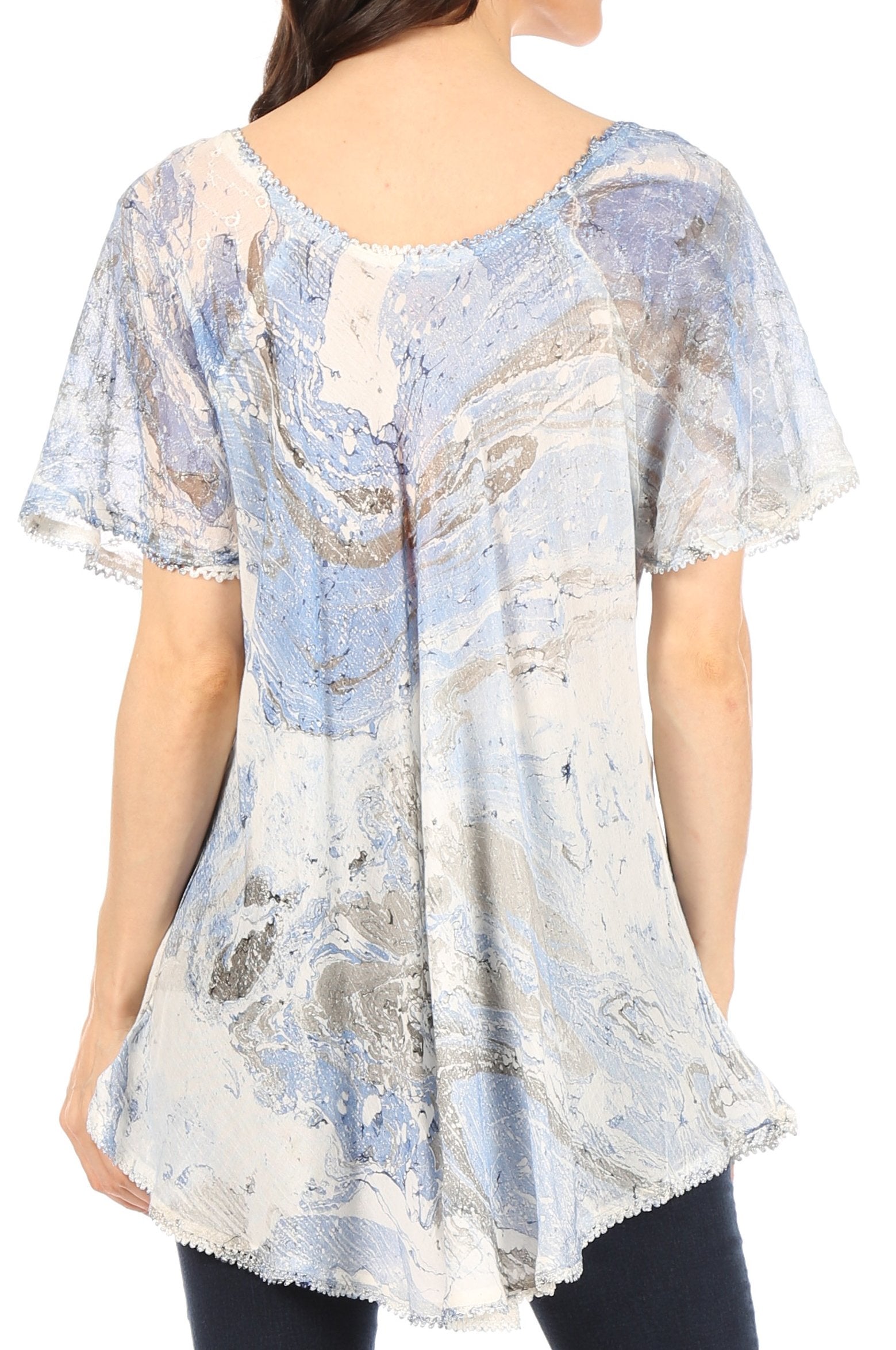 Woman wearing a short-sleeve, patterned blouse with a white background