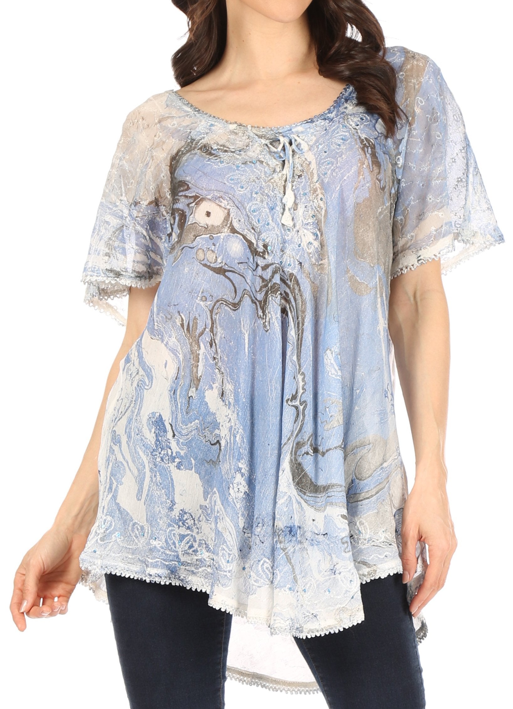 Woman wearing a blue patterned blouse with a white background