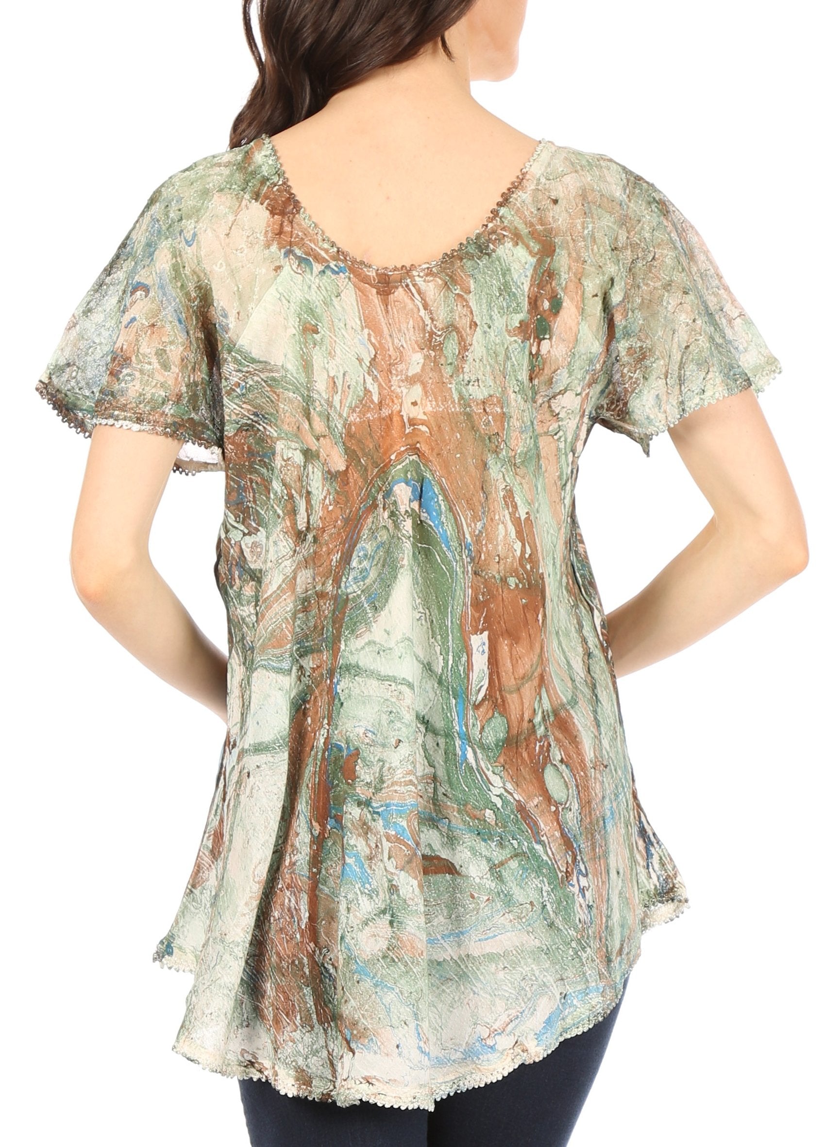 Woman wearing a patterned blouse with a white background