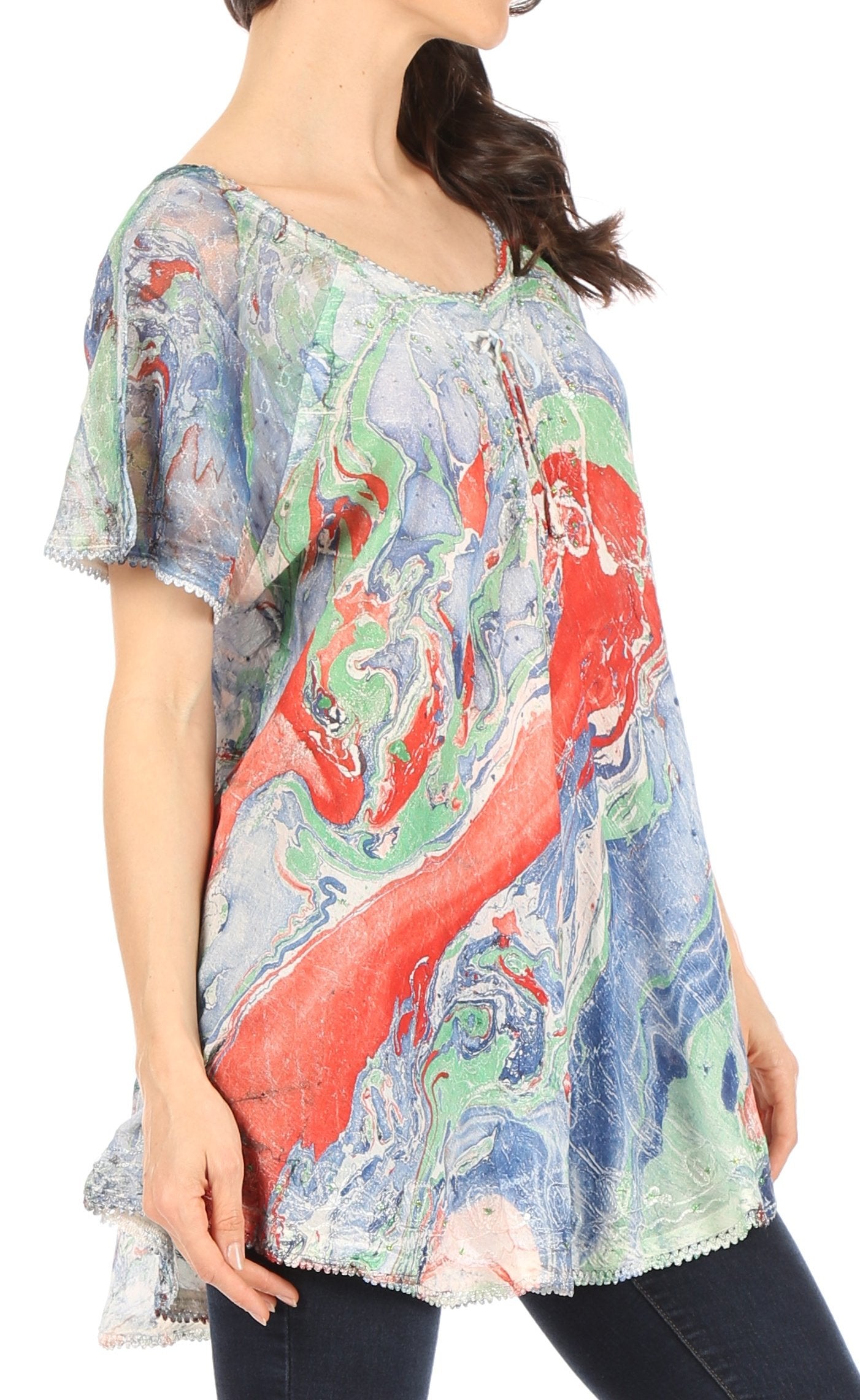 Woman wearing a colorful abstract patterned top on a white background