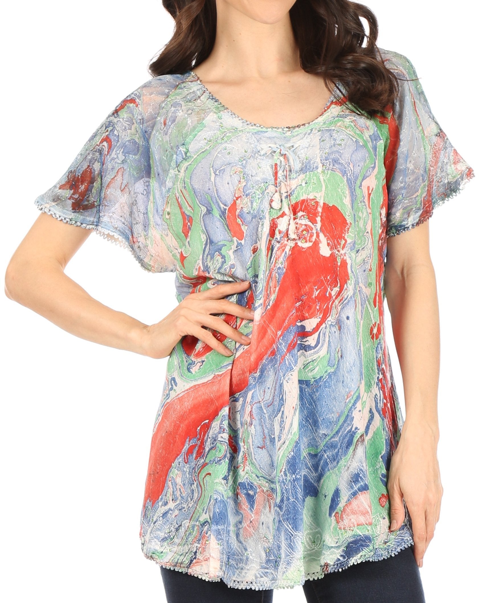 Woman wearing a colorful parrot print top on a white background