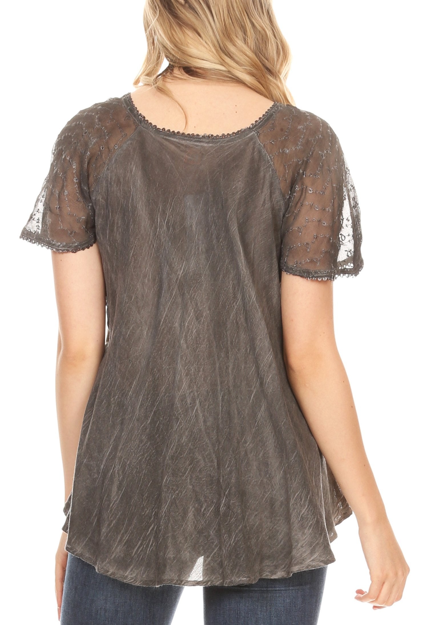 Brown sheer blouse worn by a person on a white background