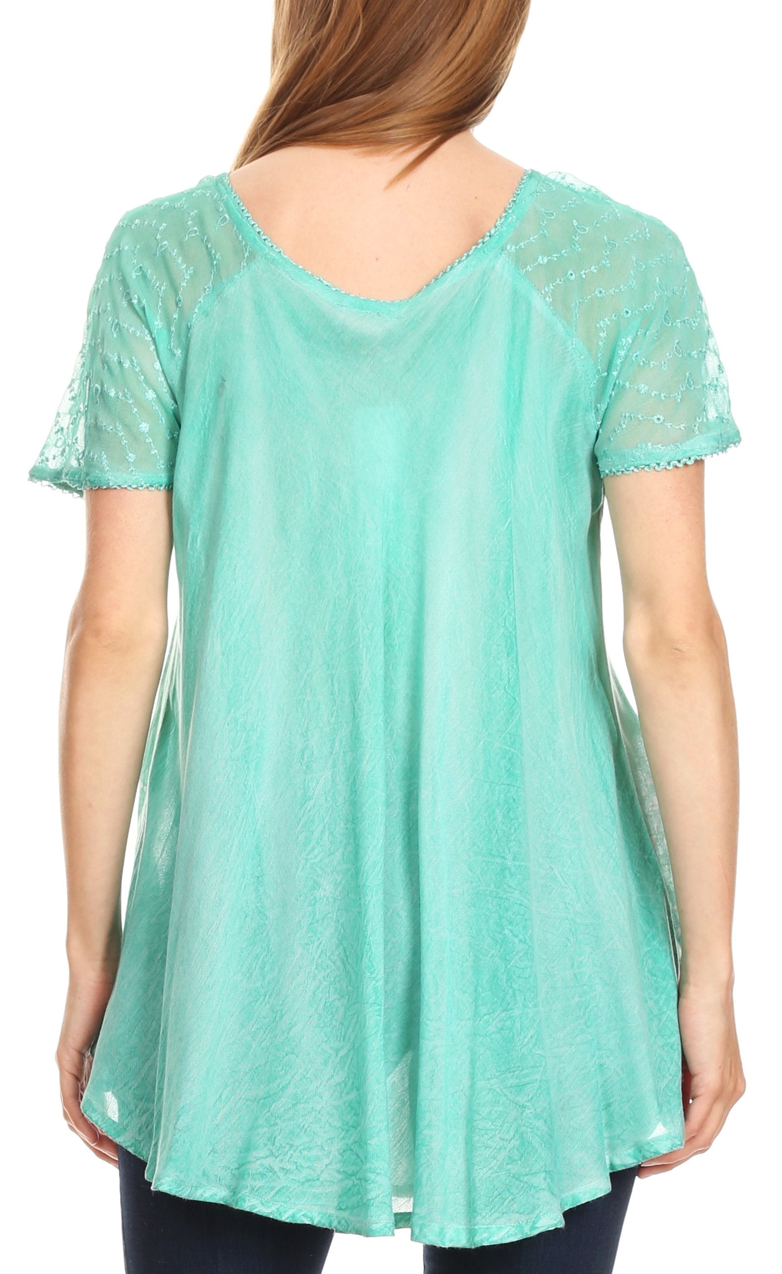 Mint green lace-trimmed top worn by a person on a white background