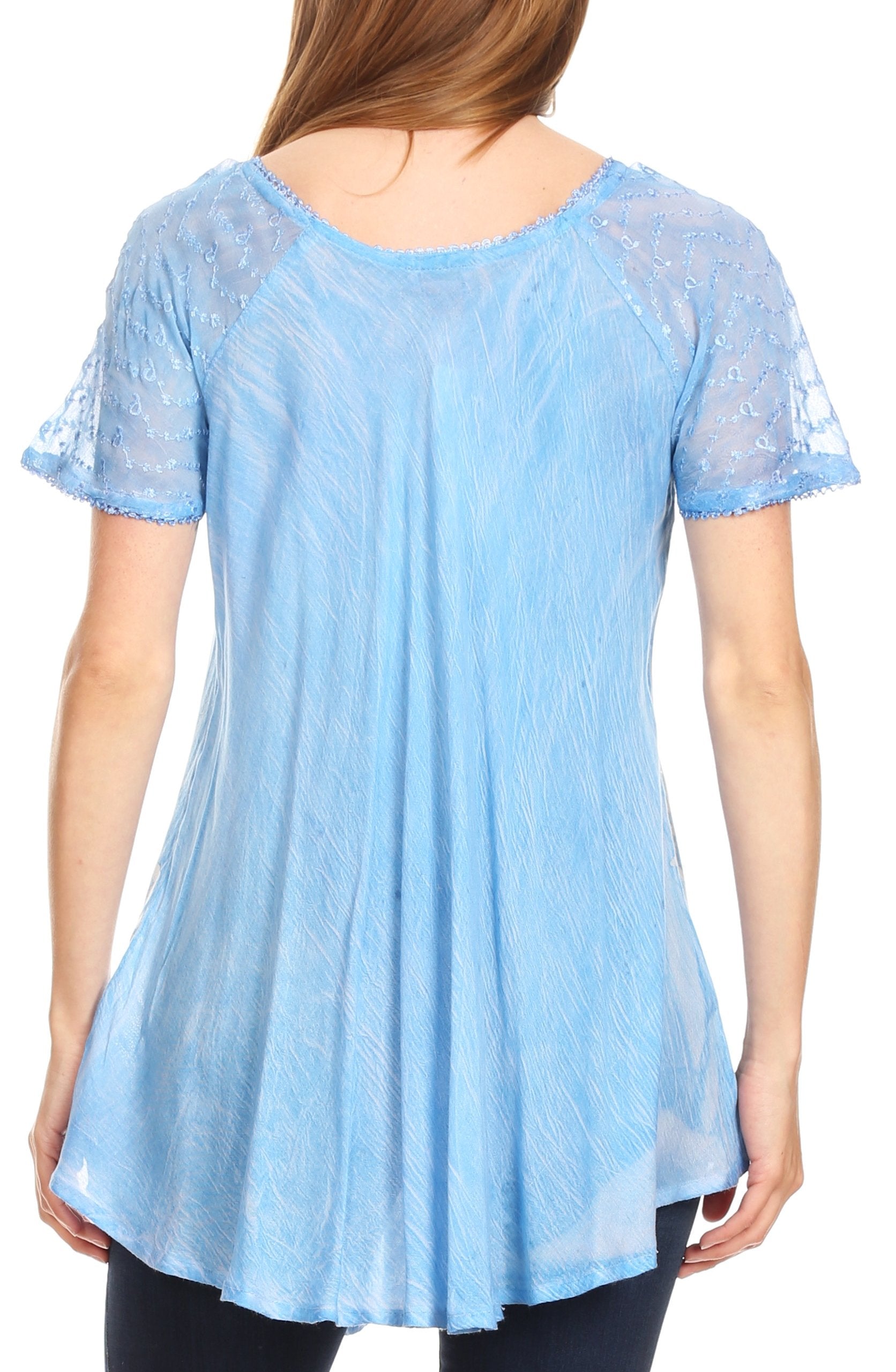 Light blue lace top worn by a person on a white background