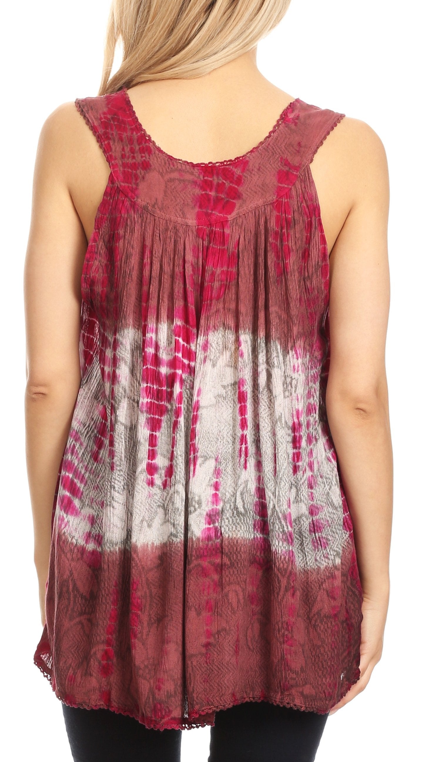 Red and white patterned sleeveless top worn by a person on a white background