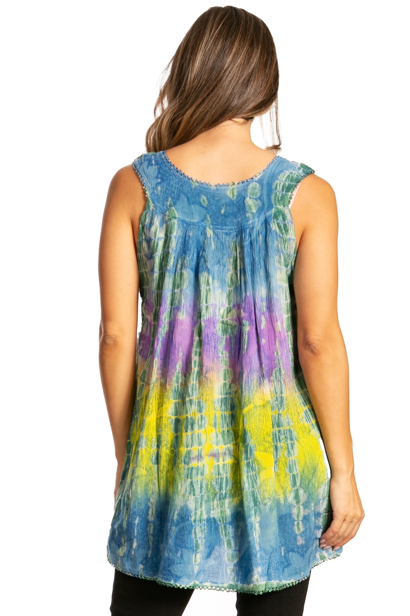 Woman wearing a tie-dye sleeveless top with blue, green, and purple patterns on a white background.