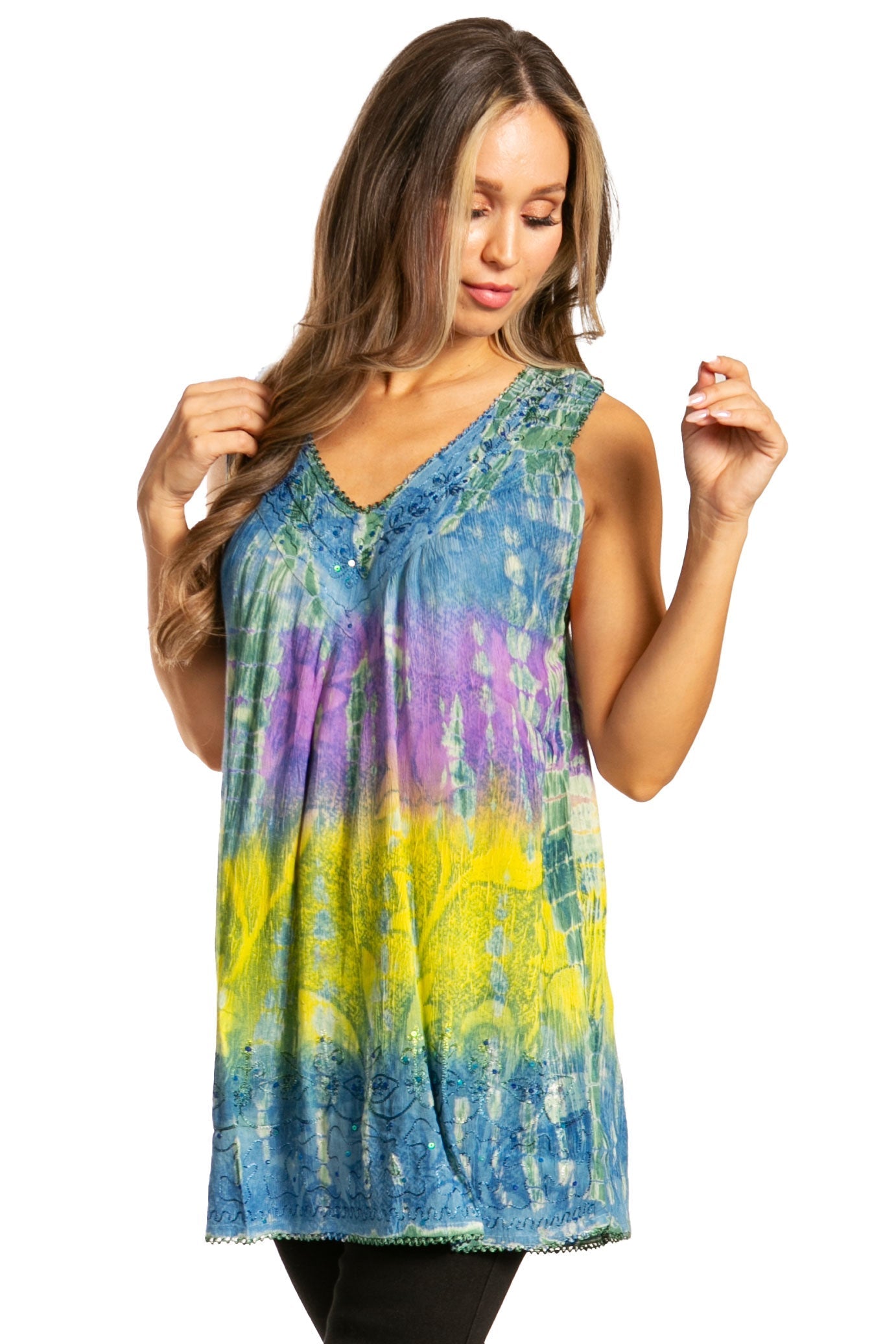 Woman wearing a colorful tie-dye sleeveless top on a white background