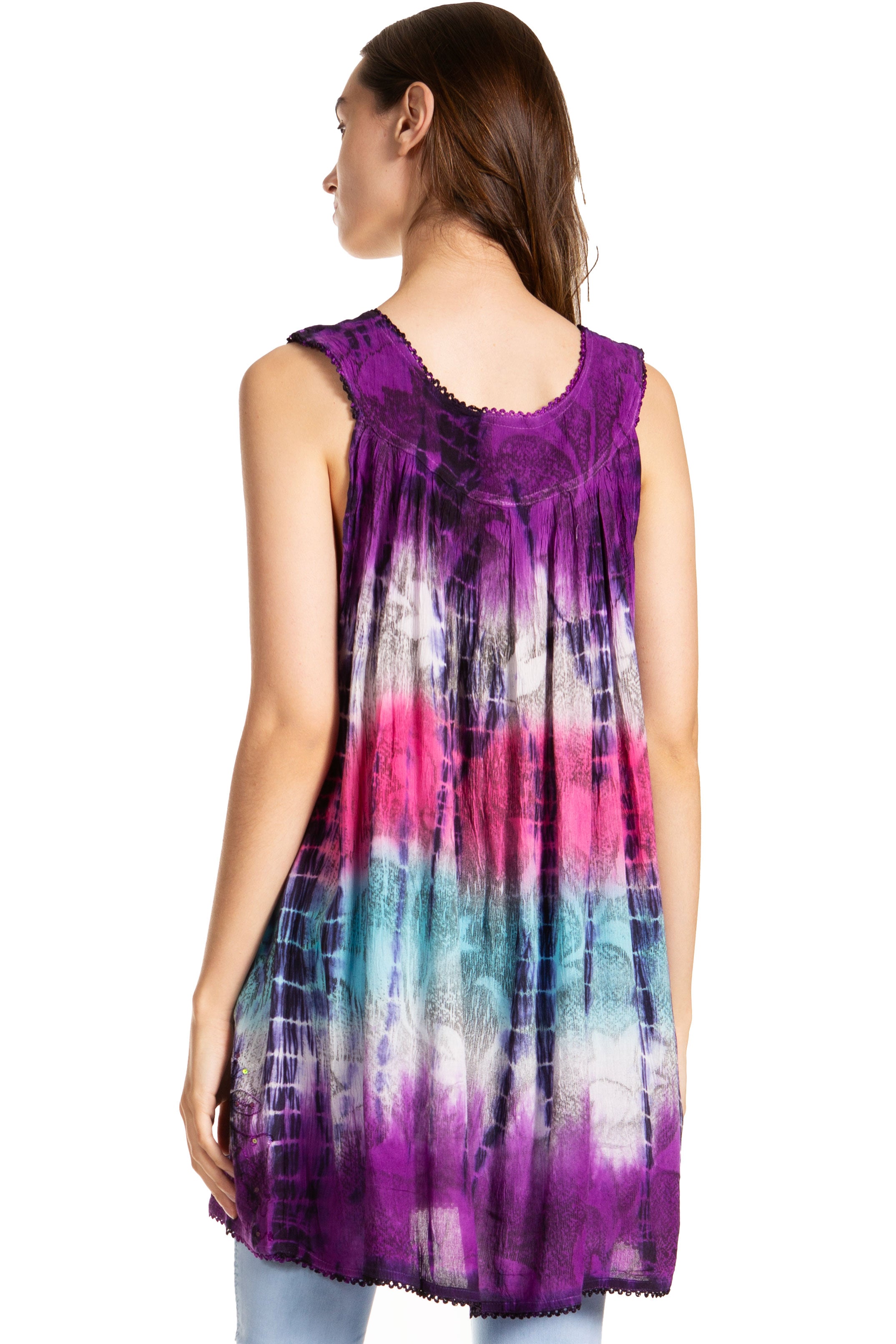 Woman wearing a tie-dye sleeveless top with a white background