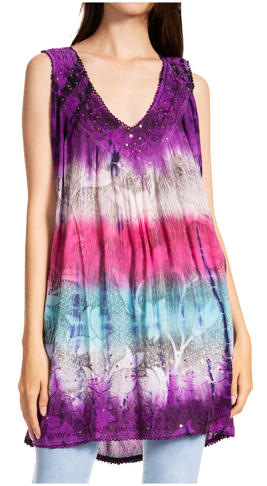 Woman wearing a tie-dye tank top with a gradient of purple, pink, and blue.