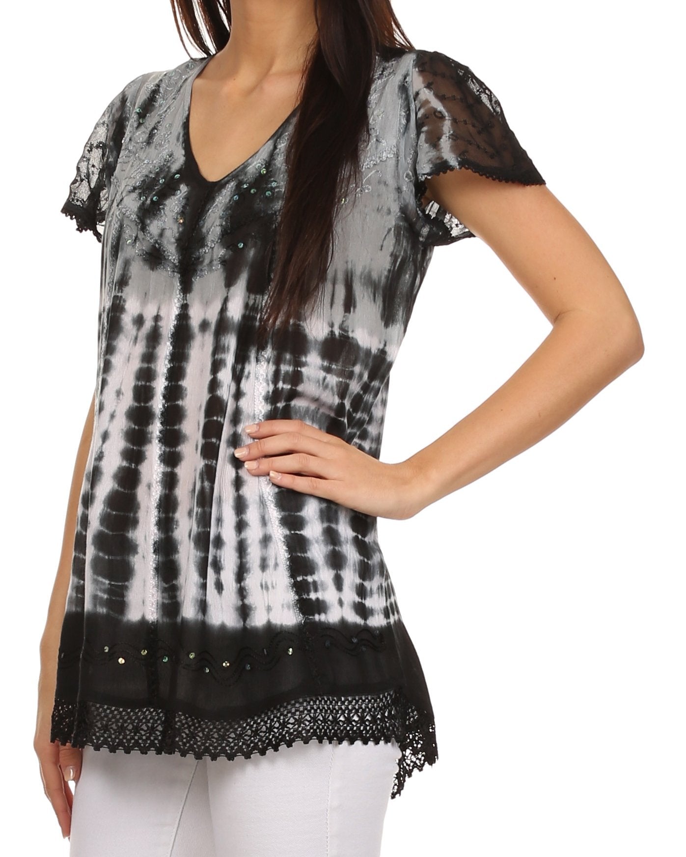 Black and white tie-dye top with lace details on a model against a white background
