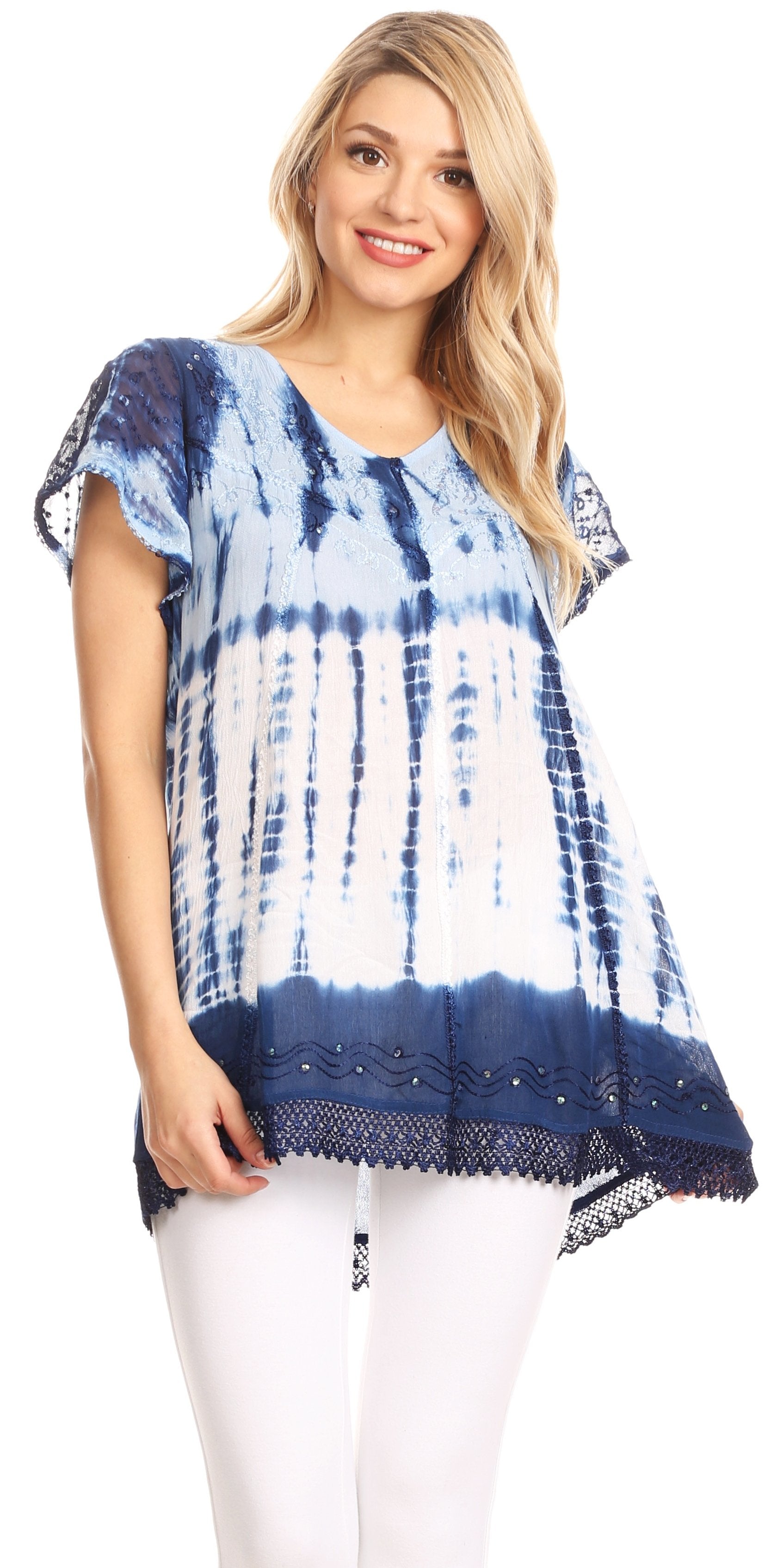 Woman wearing a blue and white tie-dye top with lace trim on a white background