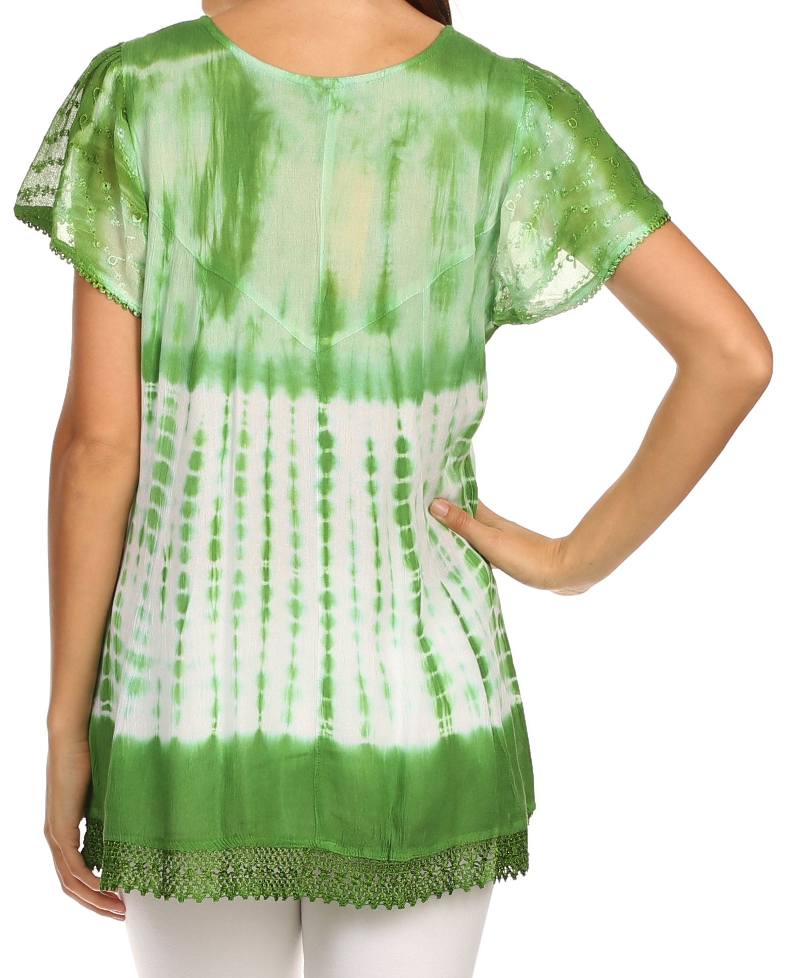 Green and white tie-dye top worn by a person on a white background