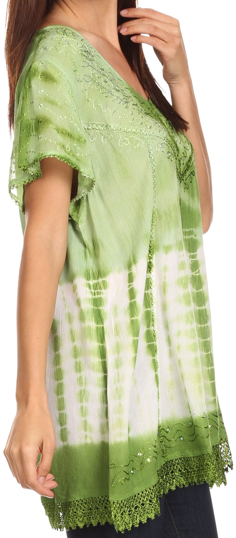 Green and white tie-dye top with lace details worn by a model.