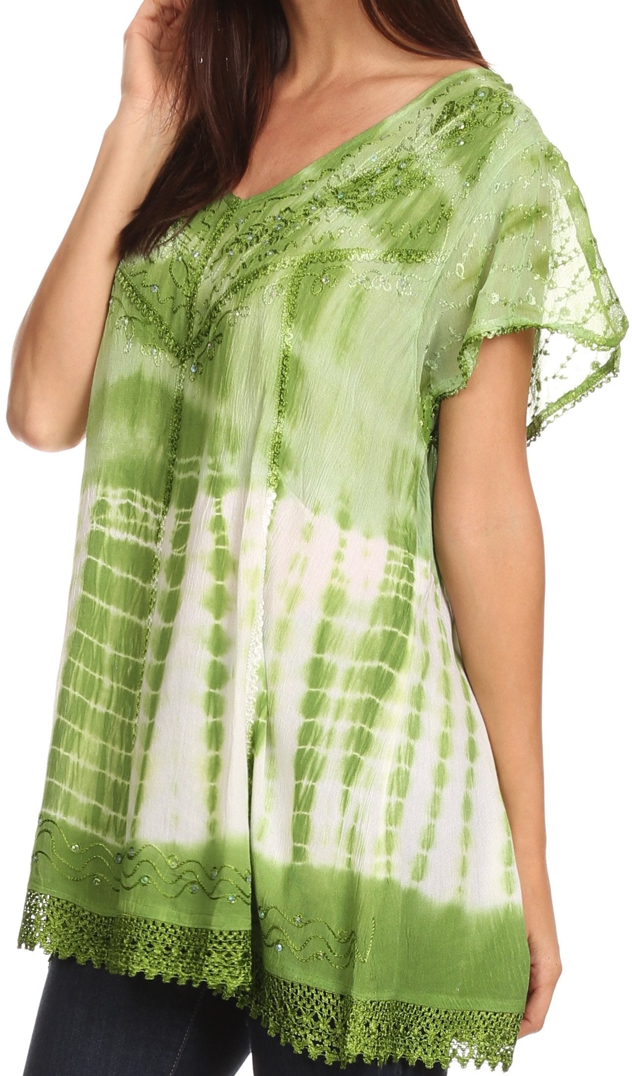 Green and white patterned top with lace trim on a plain background