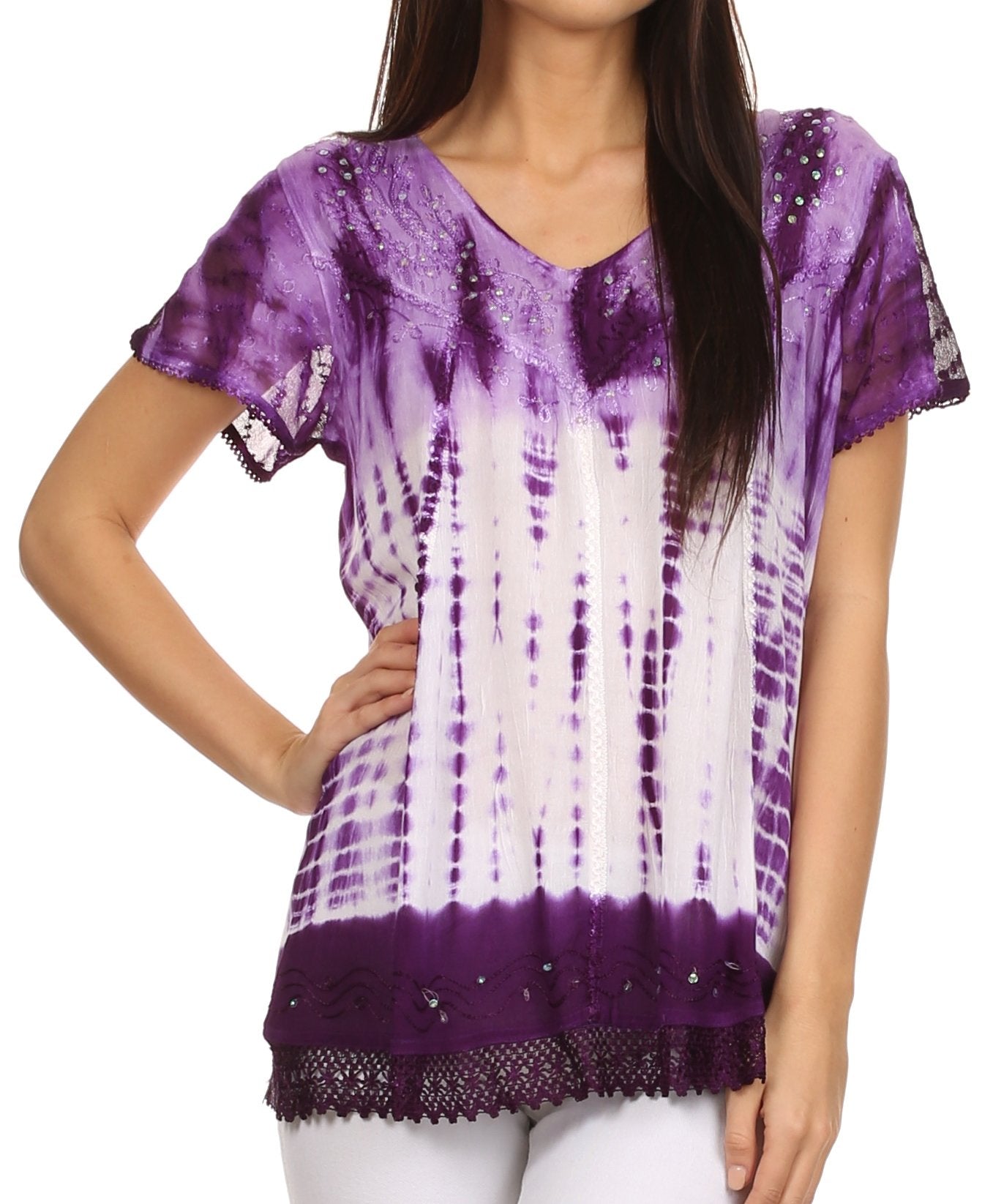 Woman wearing a purple and white tie-dye top with lace trim on a white background