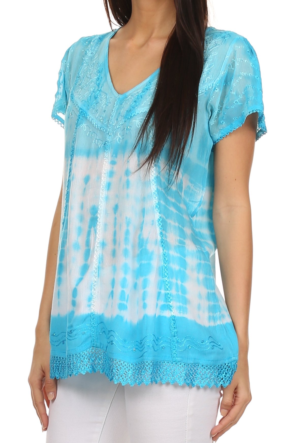 Woman wearing a blue tie-dye top on a white background