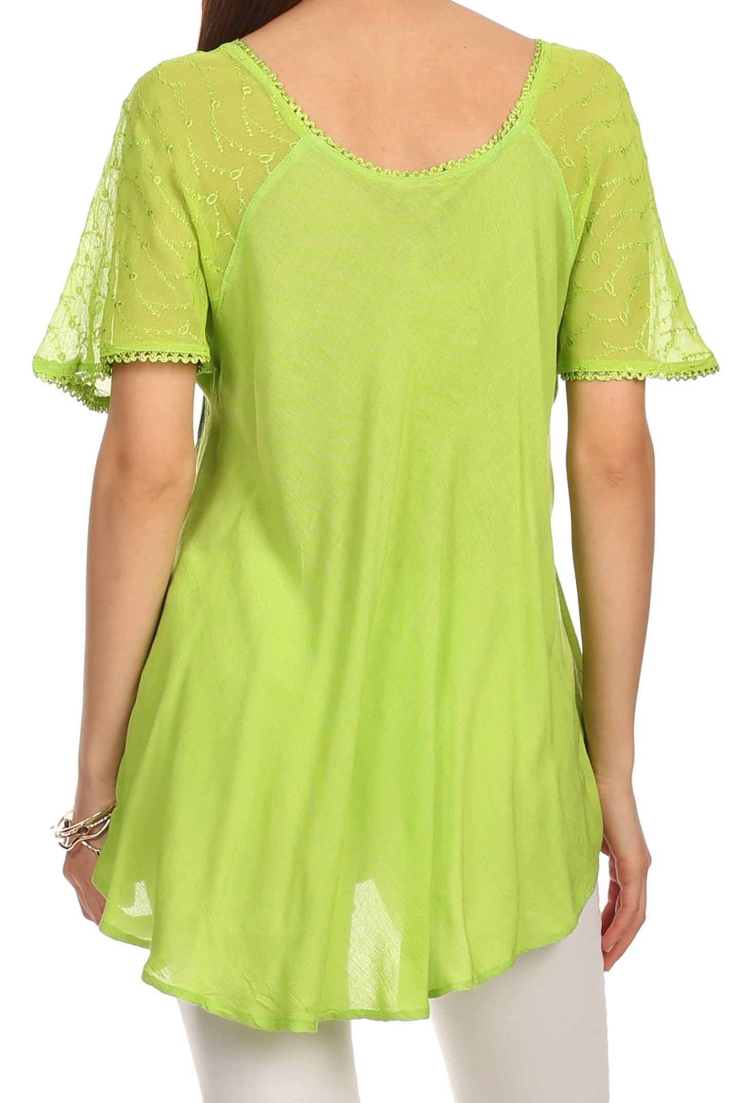 Light green lace-trimmed top worn by a person on a white background