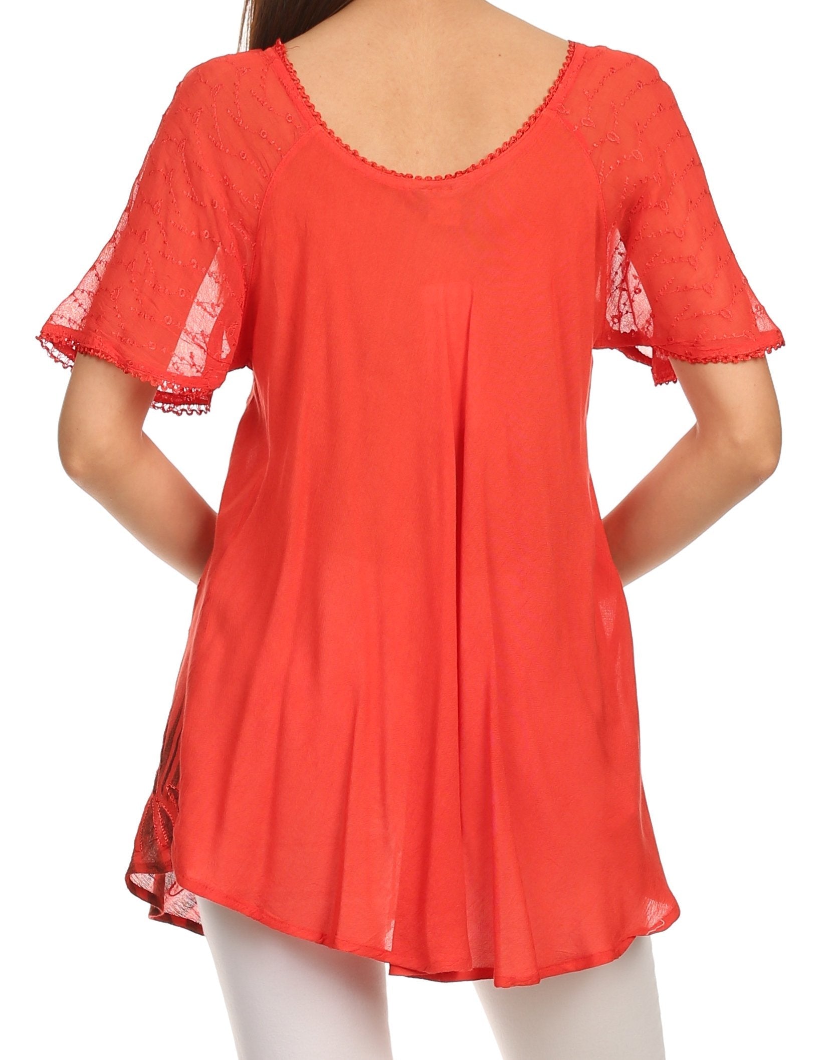 Red lace-trimmed top worn by a person on a white background