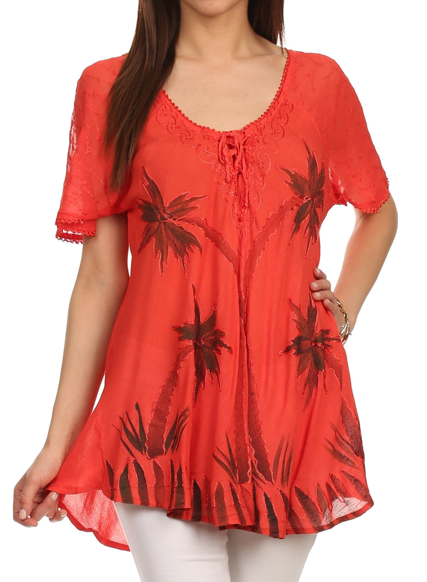 Red floral-patterned top worn by a model on a white background