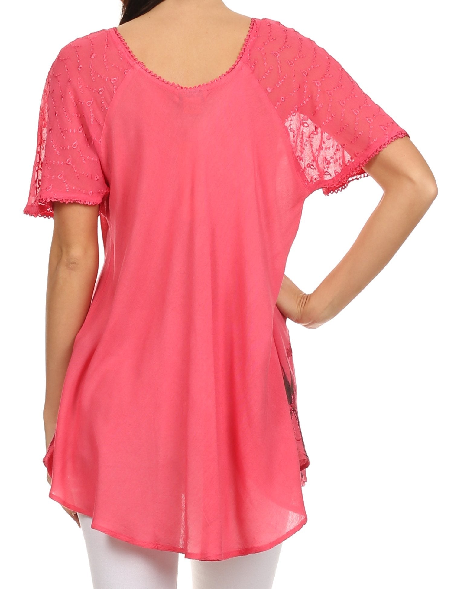 Pink lace-trimmed top worn by a person on a white background