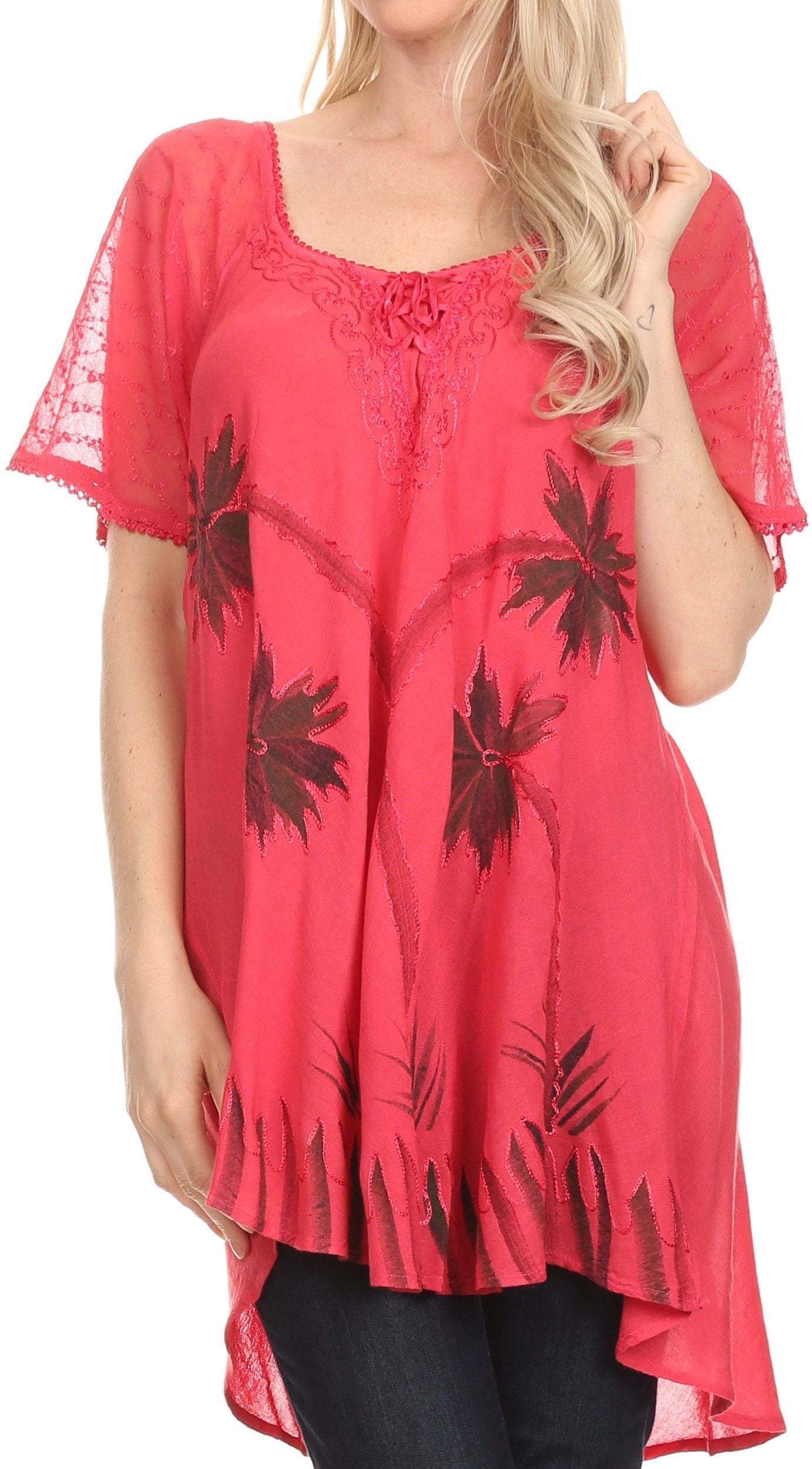 Woman wearing a red lace-trimmed dress with floral patterns on a white background