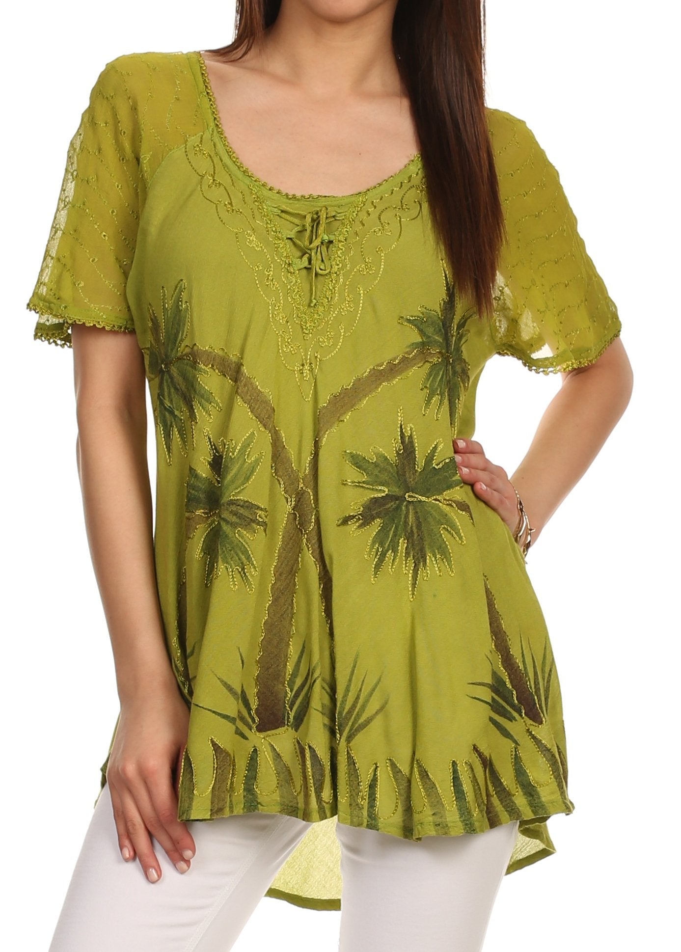 Woman wearing a green lace top with palm tree design on a white background