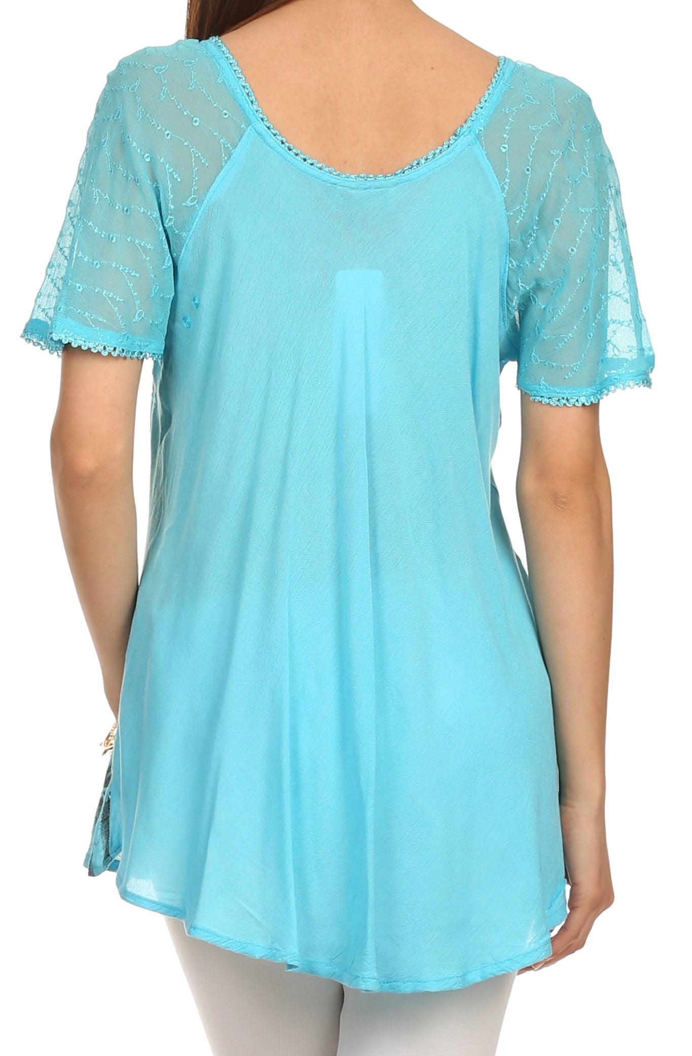 Light blue lace-trimmed top worn by a person on a white background