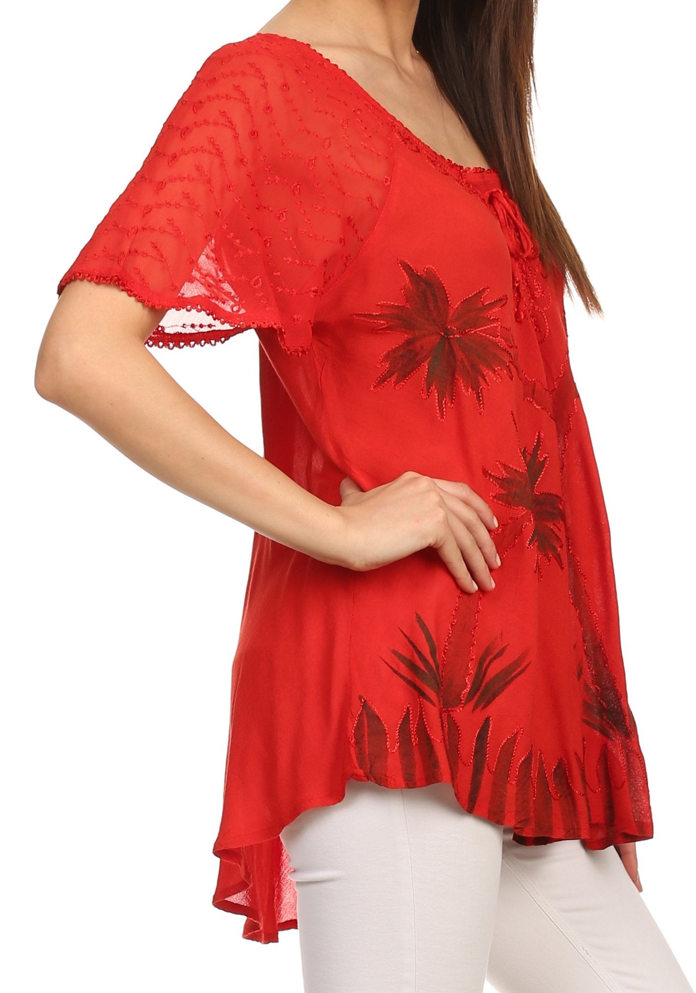 Red floral blouse worn by a person on a white background