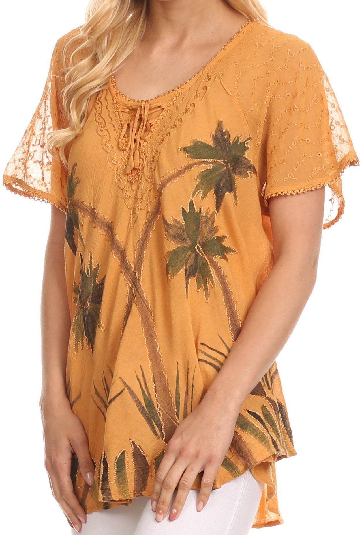 Woman wearing a mustard yellow blouse with palm tree design on a white background