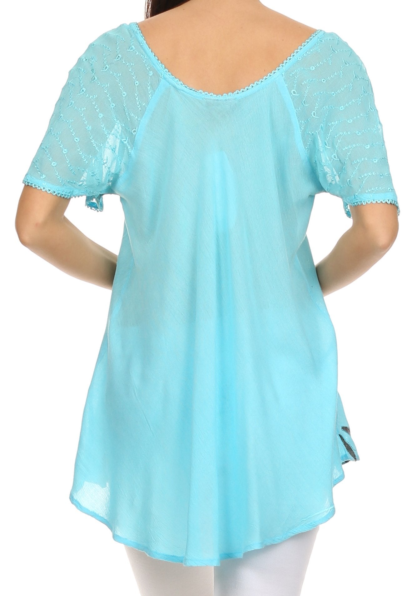 Light blue lace-trimmed top worn by a person on a white background
