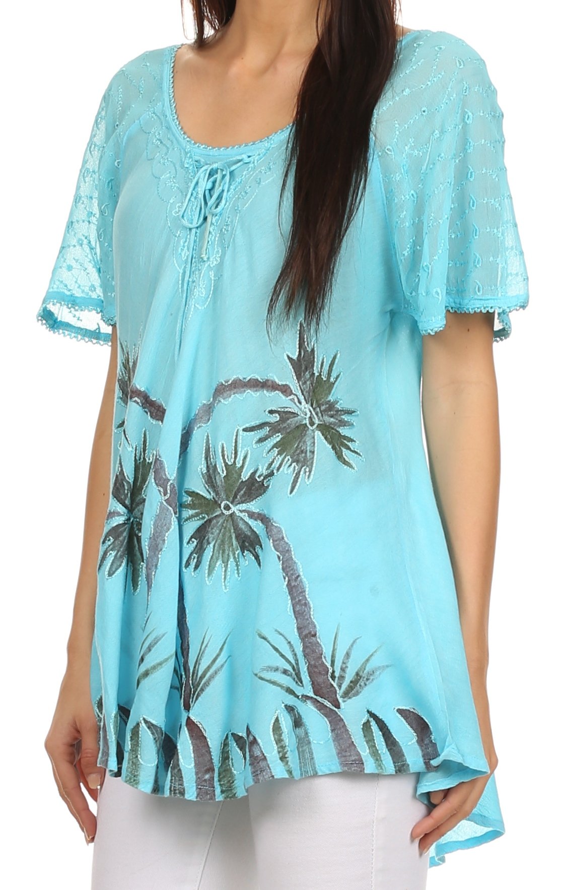 Light blue lace top with palm tree design worn by a model