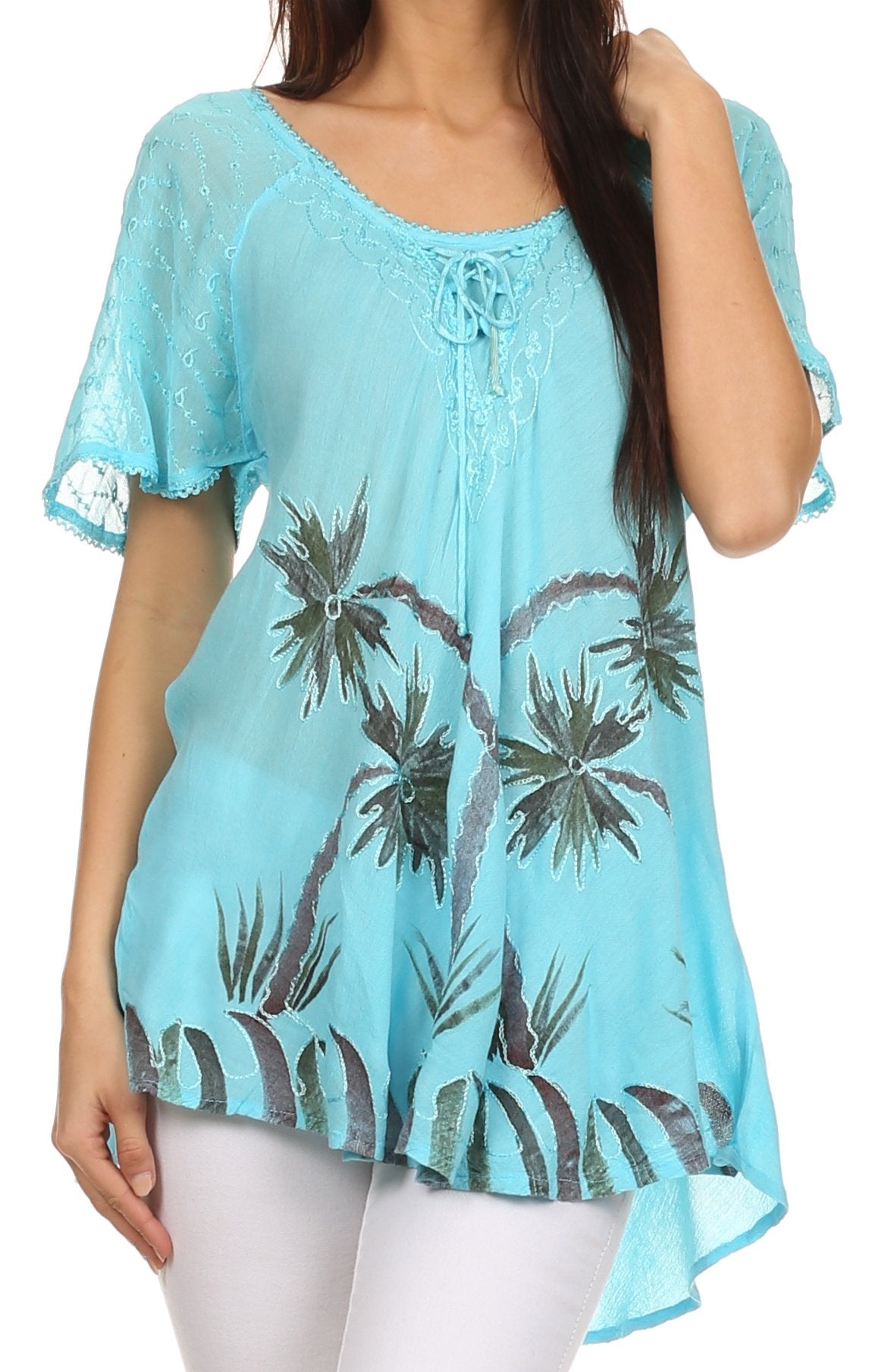 Light blue lace top with palm tree pattern worn by a person